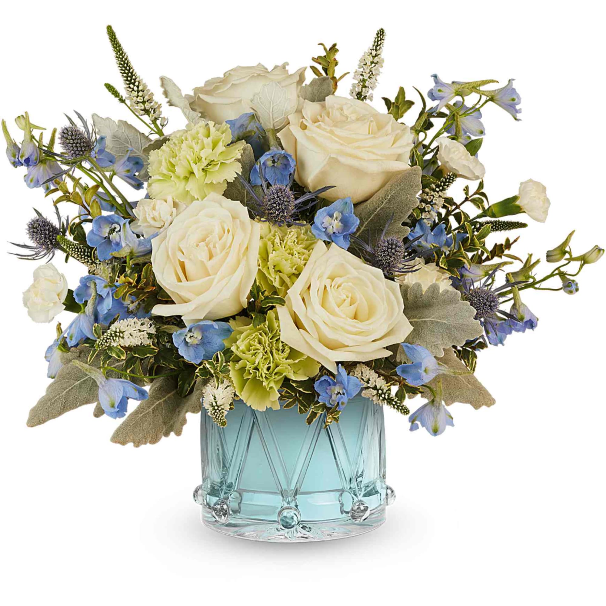 White roses and blue flowers arranged in a blue glass vase