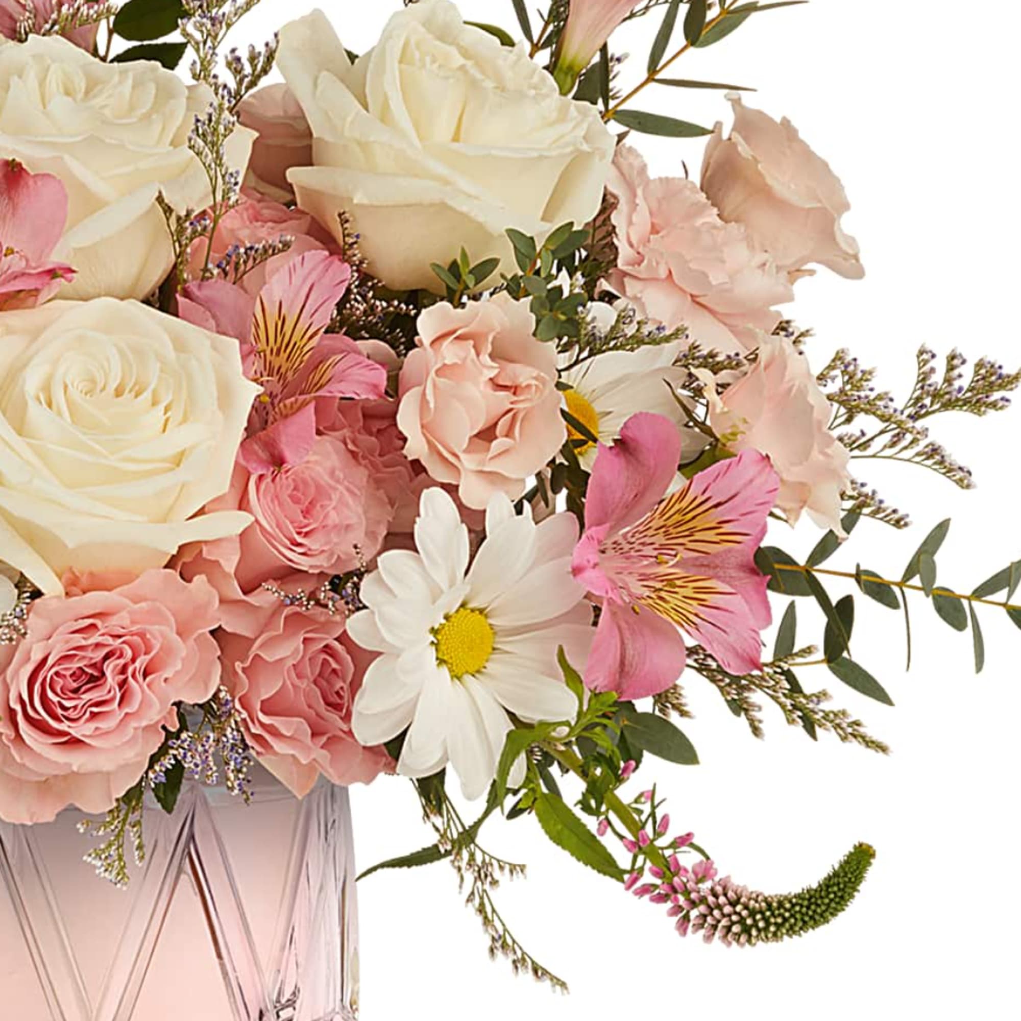Pink and white bouquet in a faceted glass vase