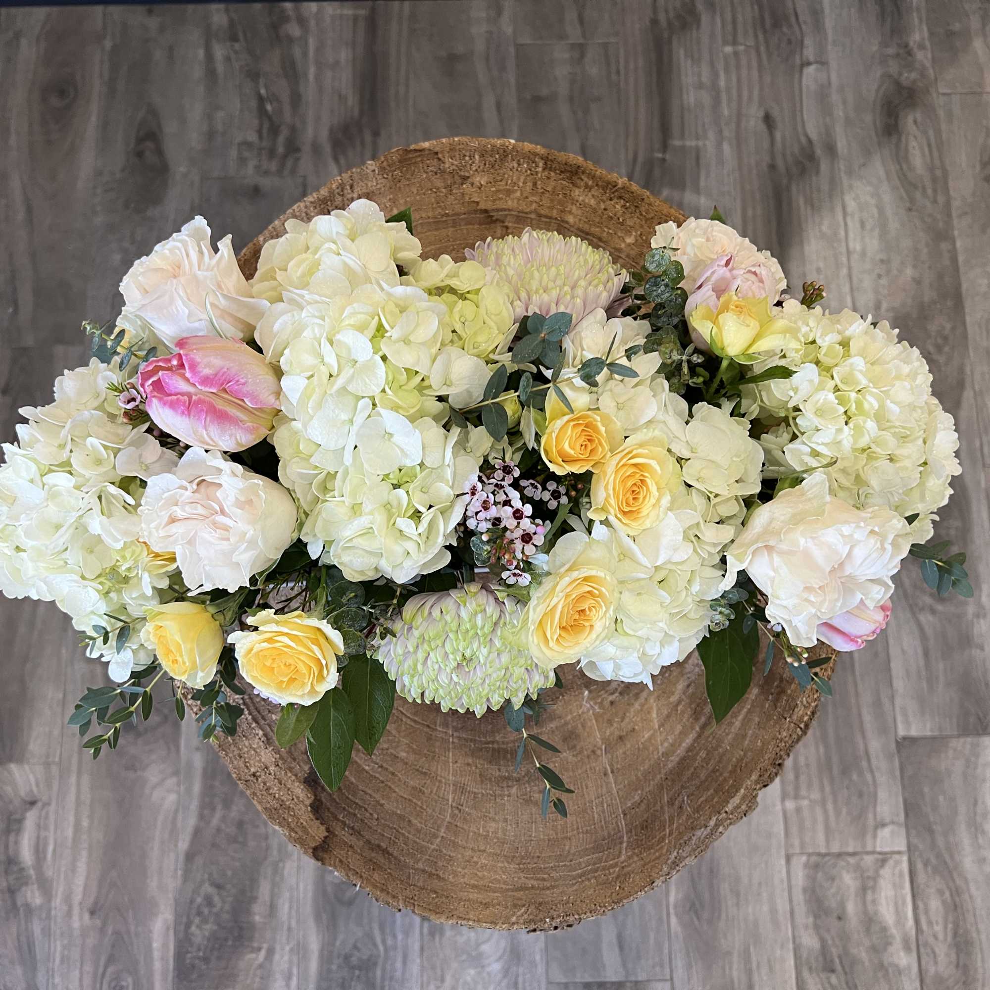 White and soft yellow roses with a variety of greenery and eucalyptus, photo 3 of 3