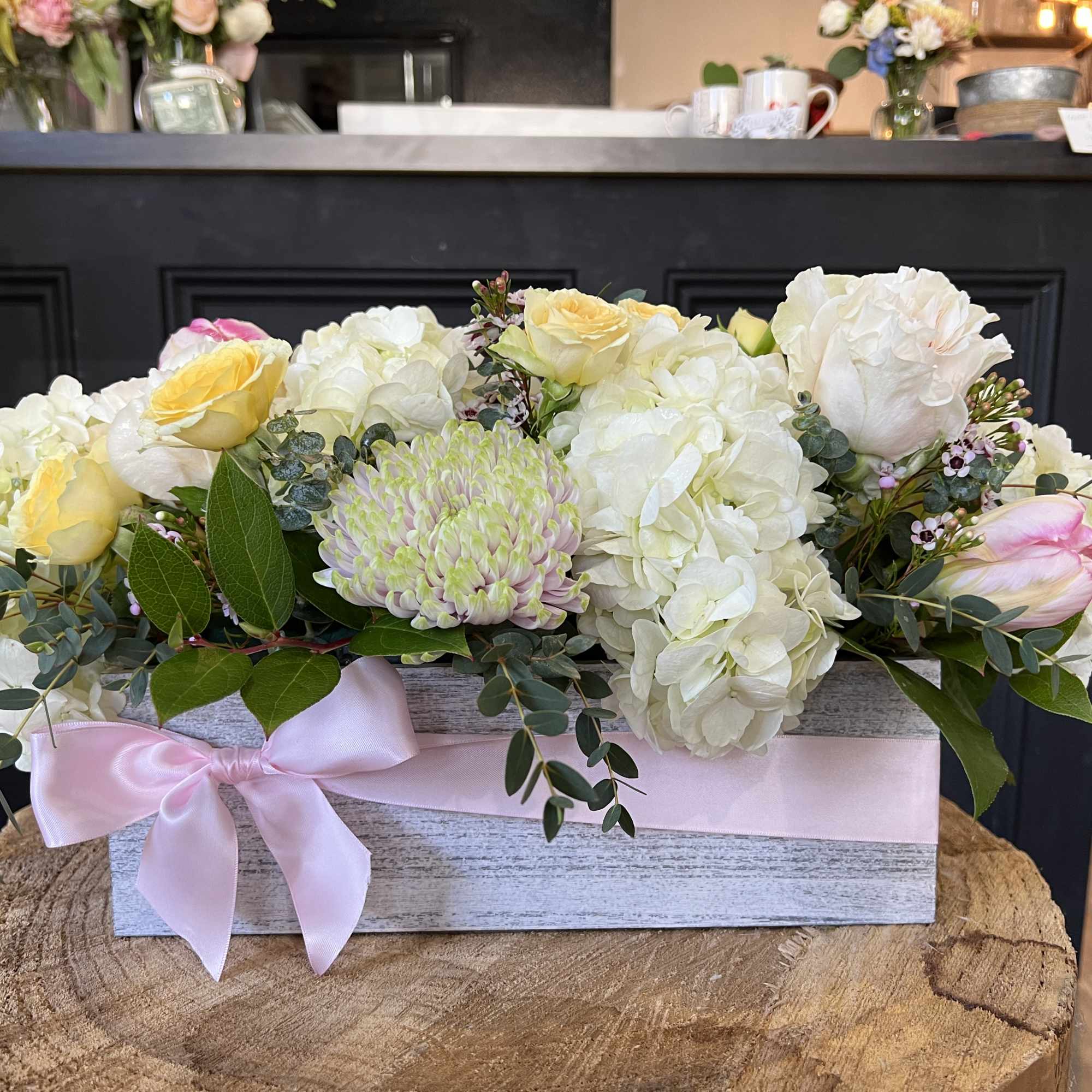 White and soft yellow roses with a variety of greenery and eucalyptus, photo 2 of 3