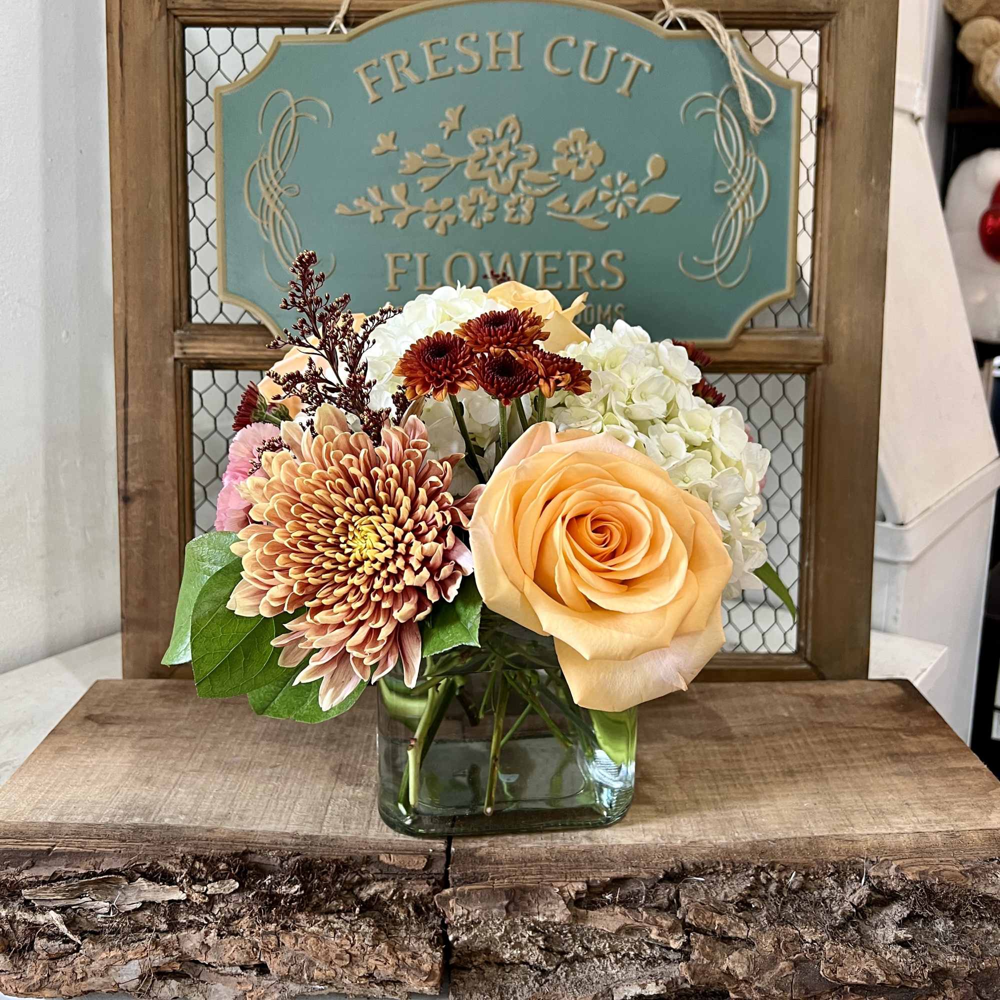 Just sit back and enjoy all the beautiful autumn colors this arrangement