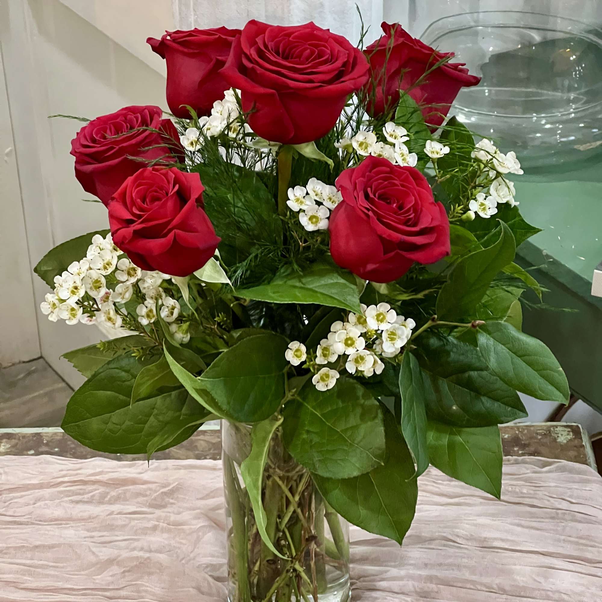 6 red roses with greenery 