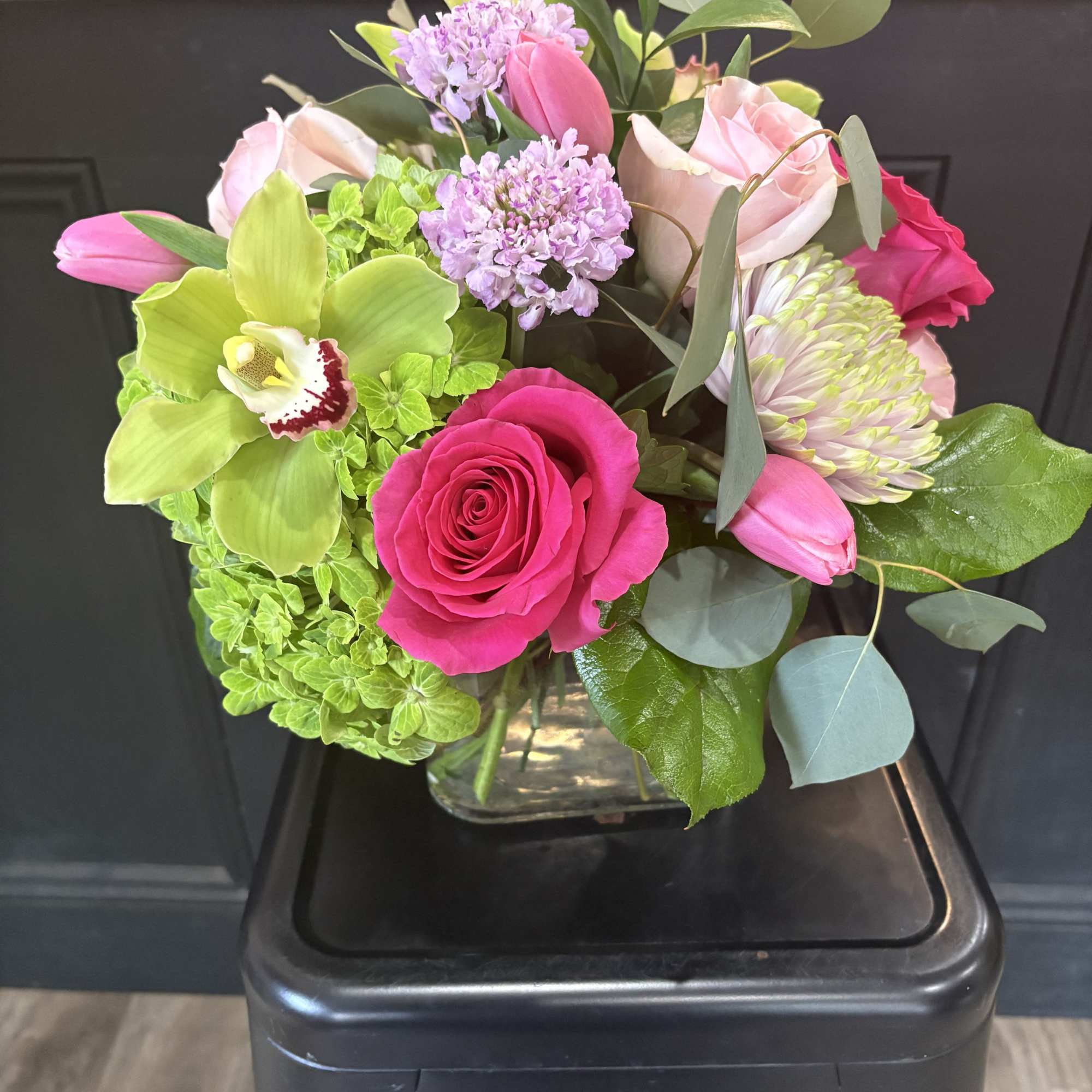 A stunning combination of hydrangeas, roses, tulips, scabiosa, cymbidum orchid and cremone, photo 2 of 3