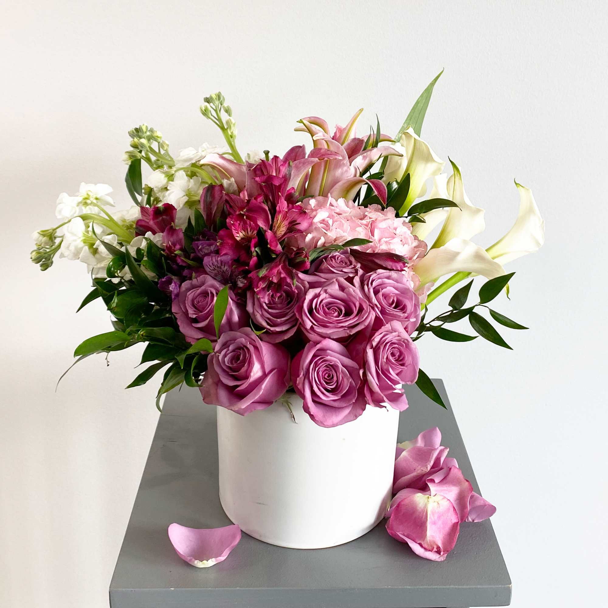 Pink and white mixed bouquet in a white vase