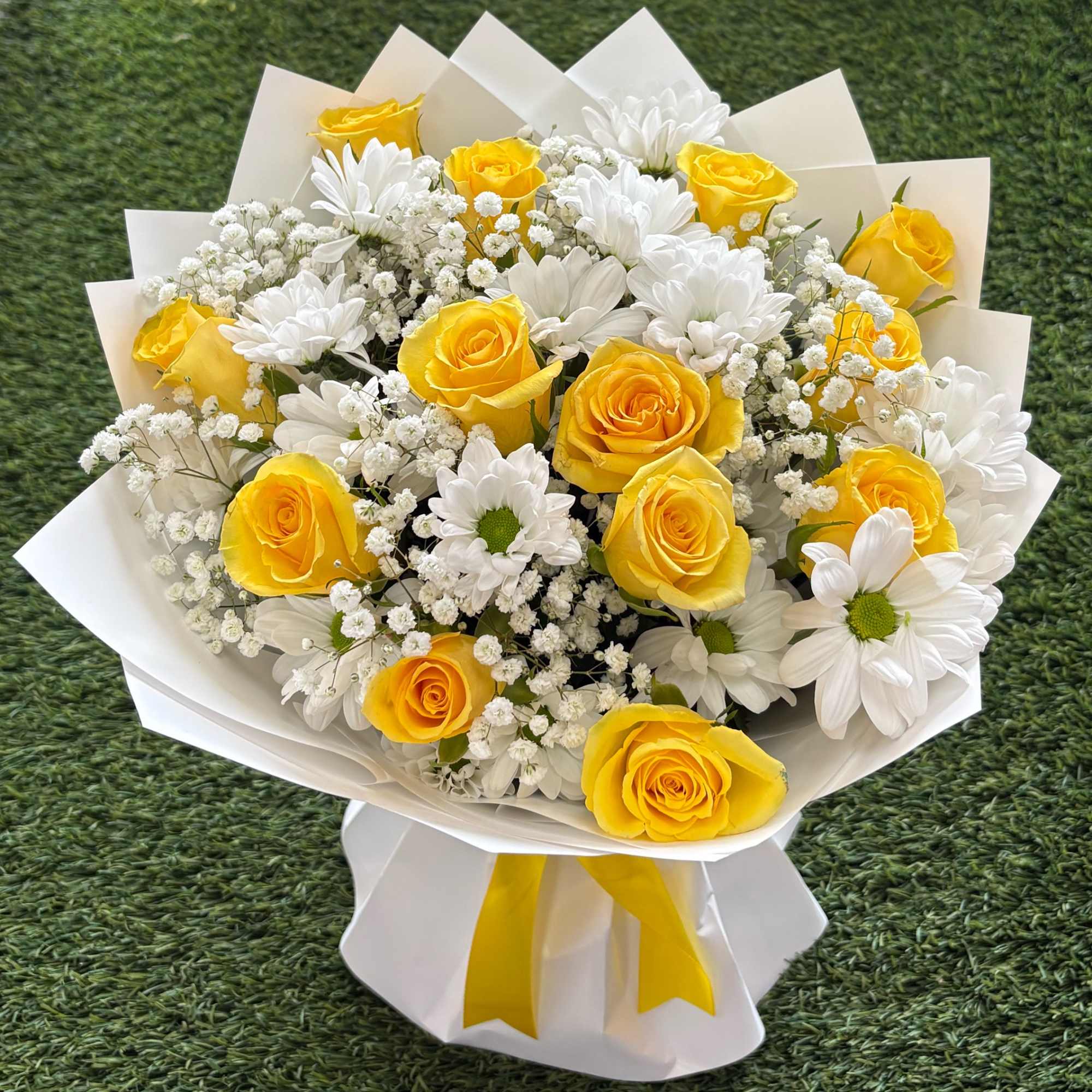 Bouquet of yellow roses and white daisies wrapped in white paper, photo 2 of 4