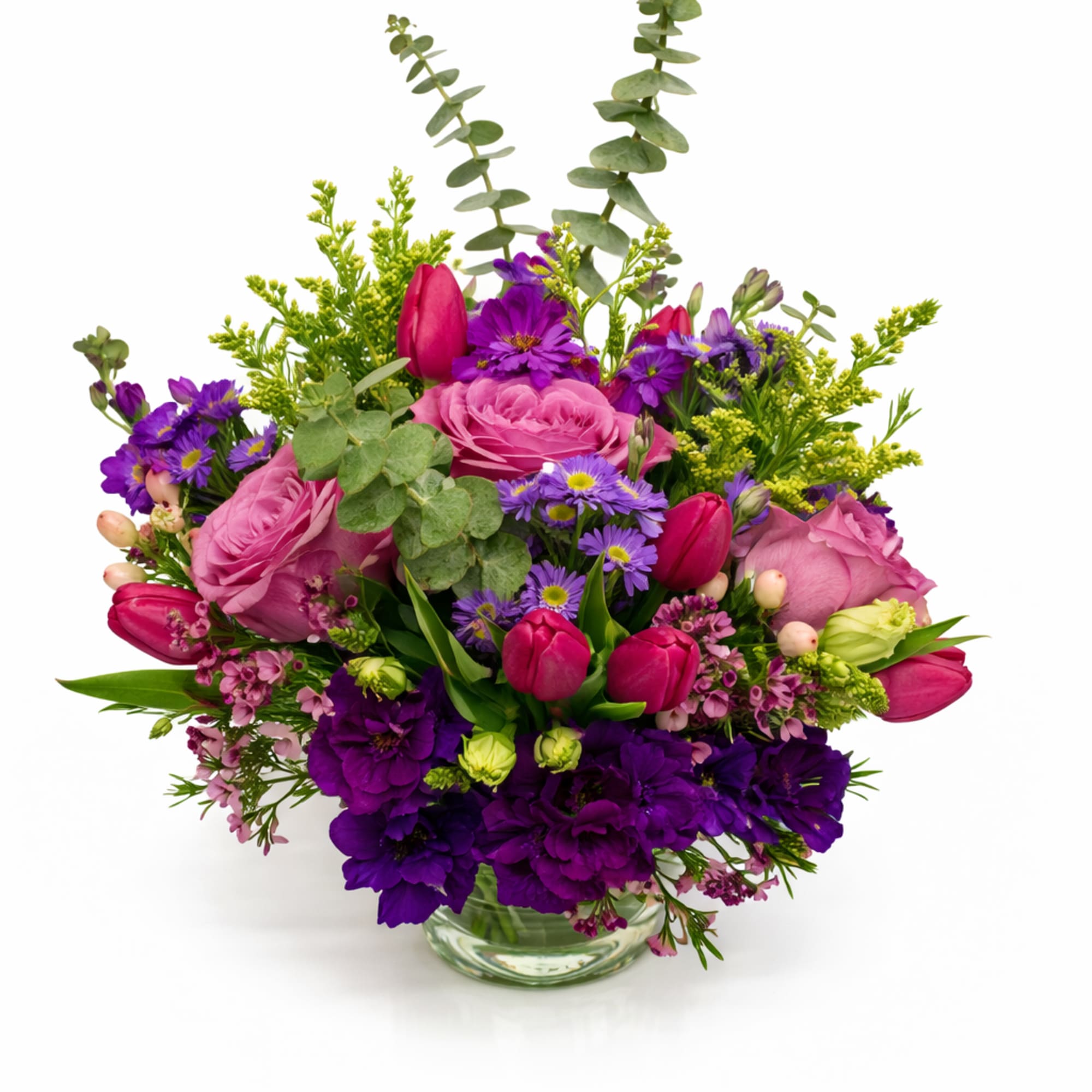 Pink and purple mixed bouquet in a clear glass vase