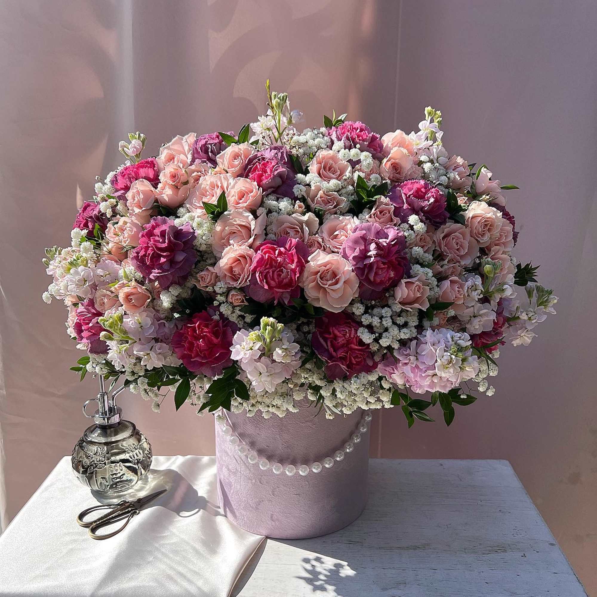 DELUXE size is shown in the picture. 
This charming arrangement showcases a