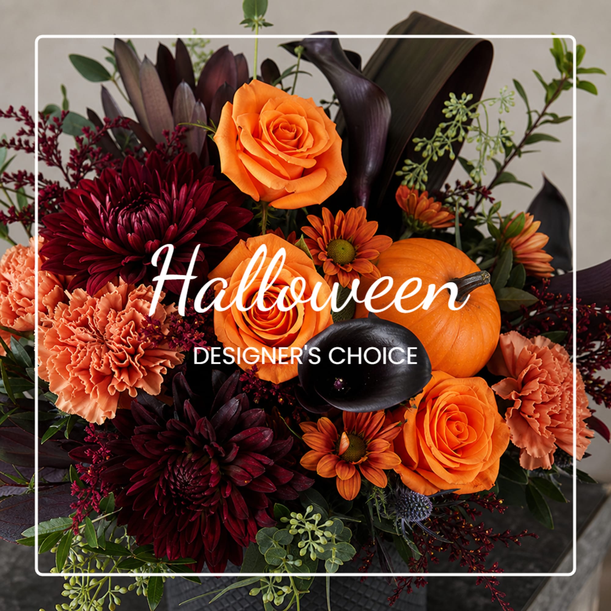 Halloween bouquet with orange roses, dark chrysanthemums, and a small pumpkin