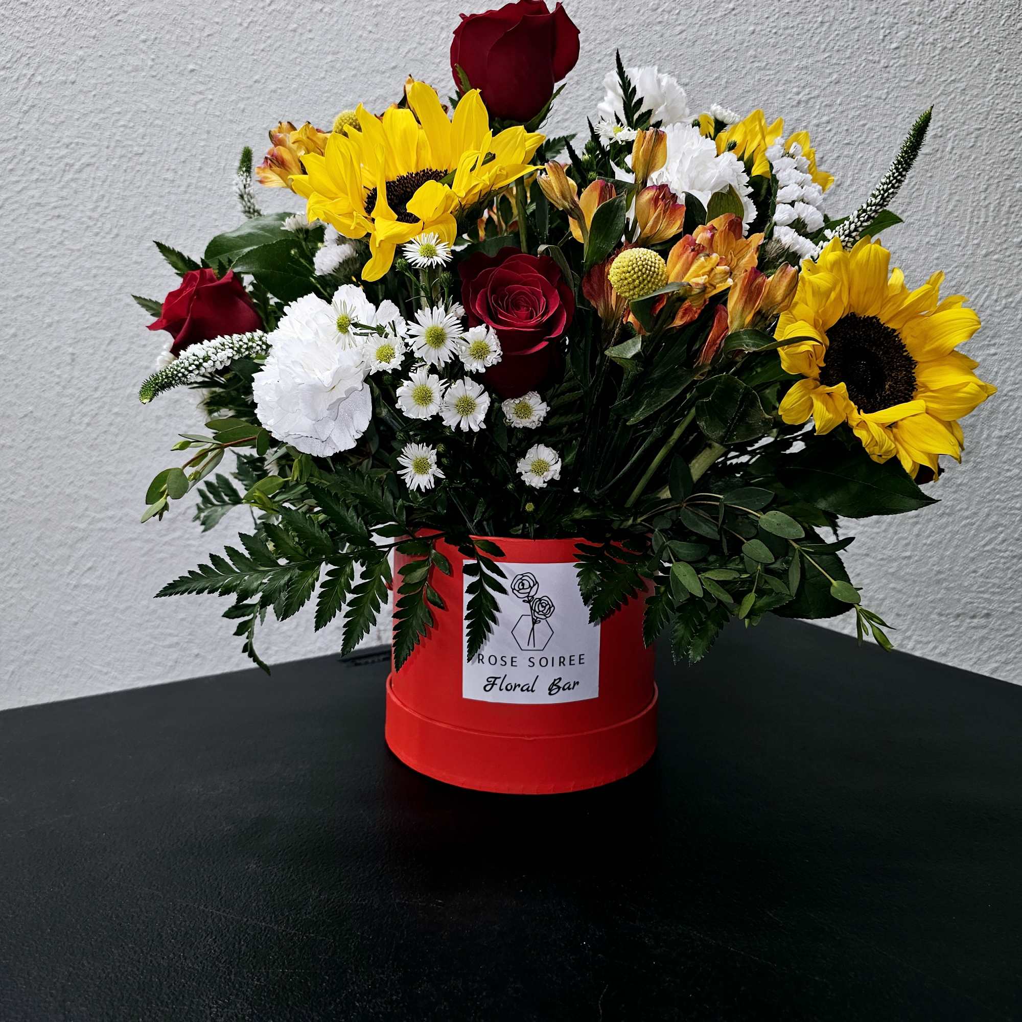 Warm, cheerful, and always a favorite.

Sunshine and Roses is a vibrant arrangement