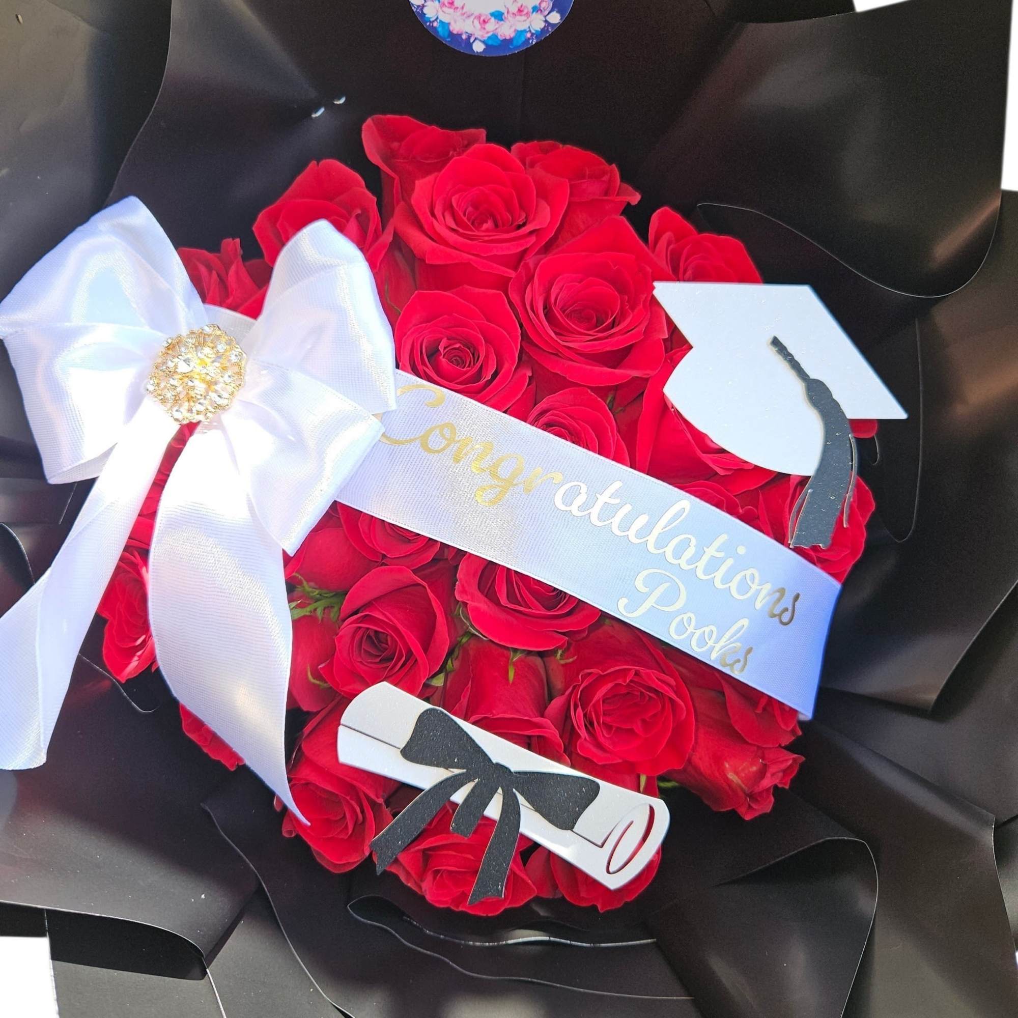 A concentrated cloud of velvety red roses creates a bold, romantic statement-designed, photo 2 of 3