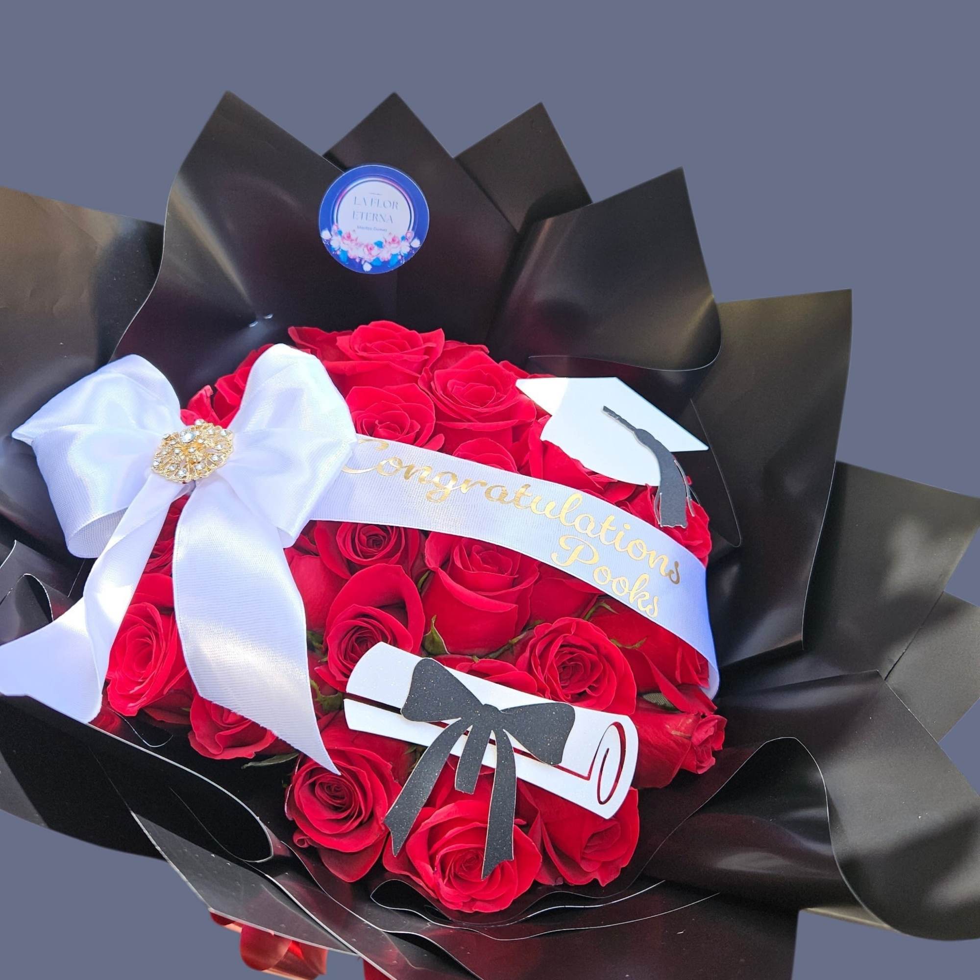 A concentrated cloud of velvety red roses creates a bold, romantic statement-designed, photo 3 of 3