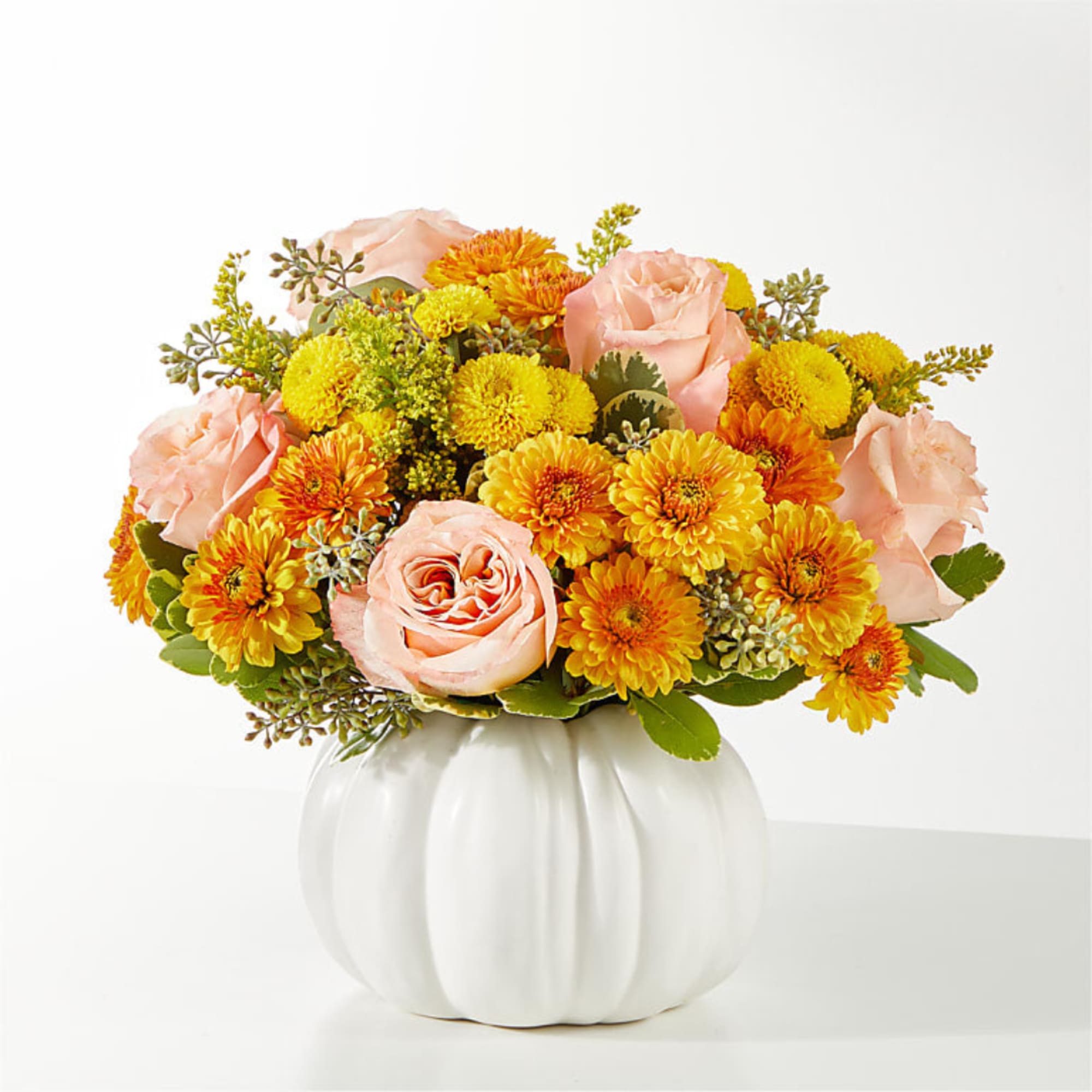 Peach roses and yellow-orange mums arranged in a white pumpkin vase, photo 2 of 4