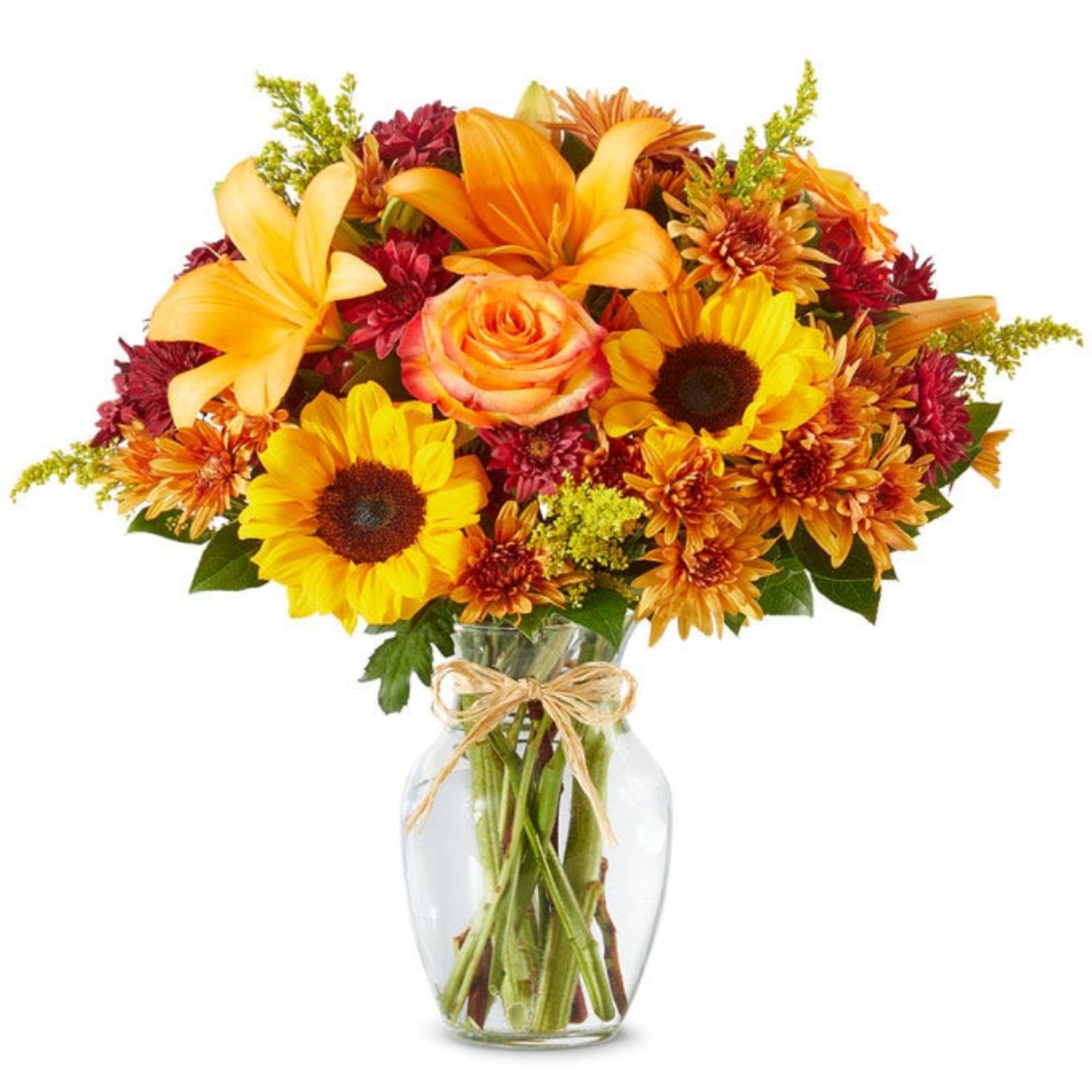 Bouquet of yellow and orange flowers in a clear glass vase