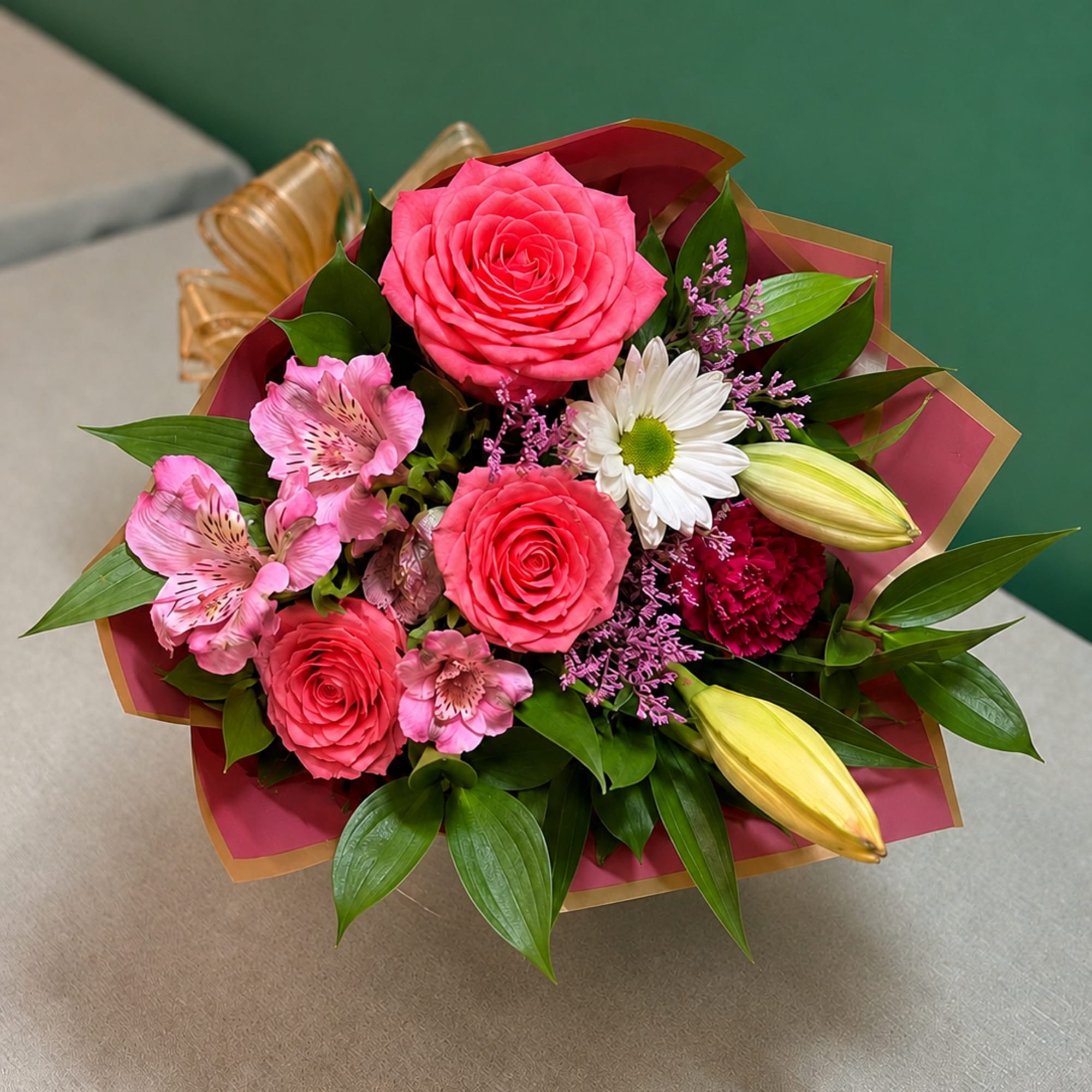 Bright pink roses and pink alstroemeria take center stage in this Blushing
