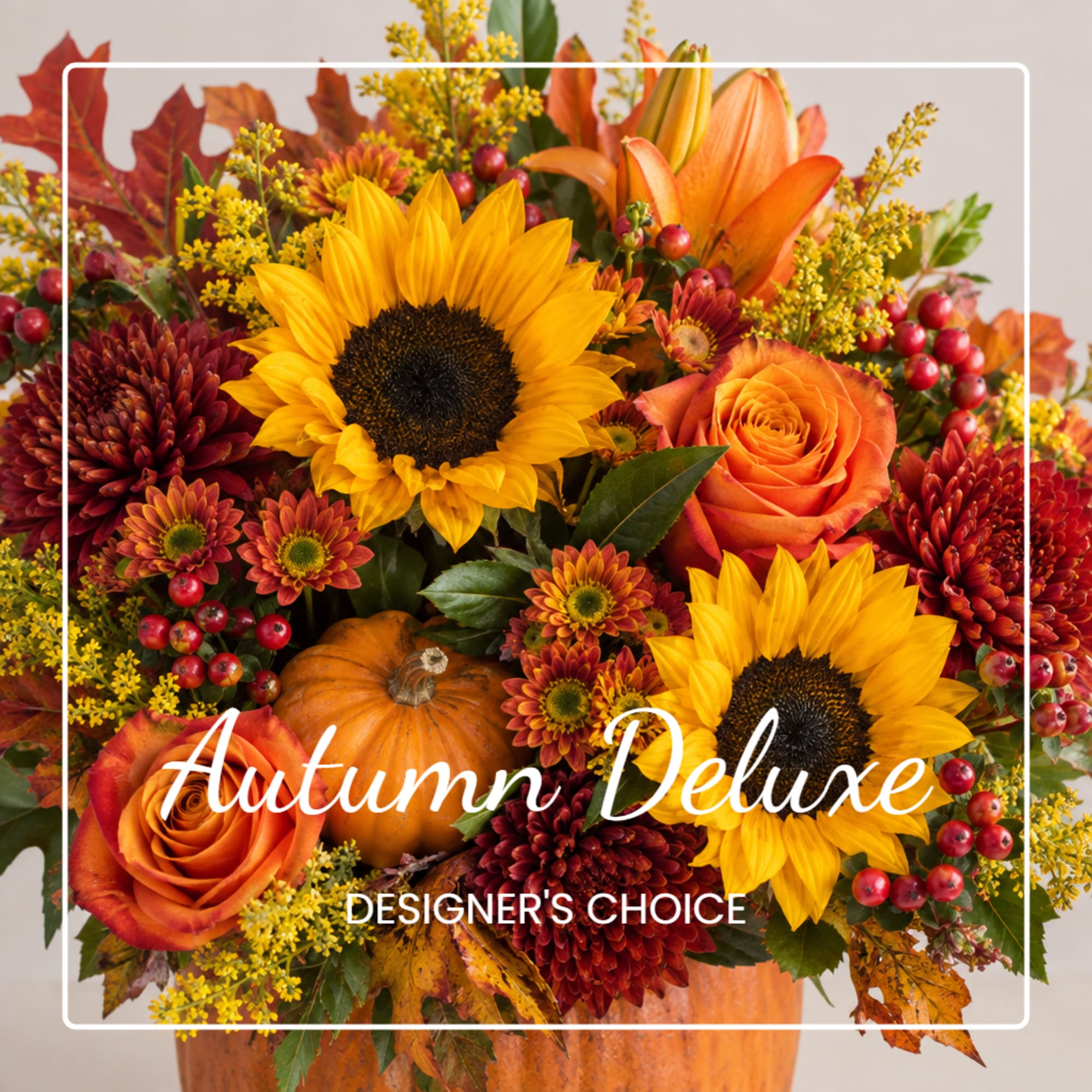 Autumn floral arrangement with sunflowers, orange roses, and a pumpkin