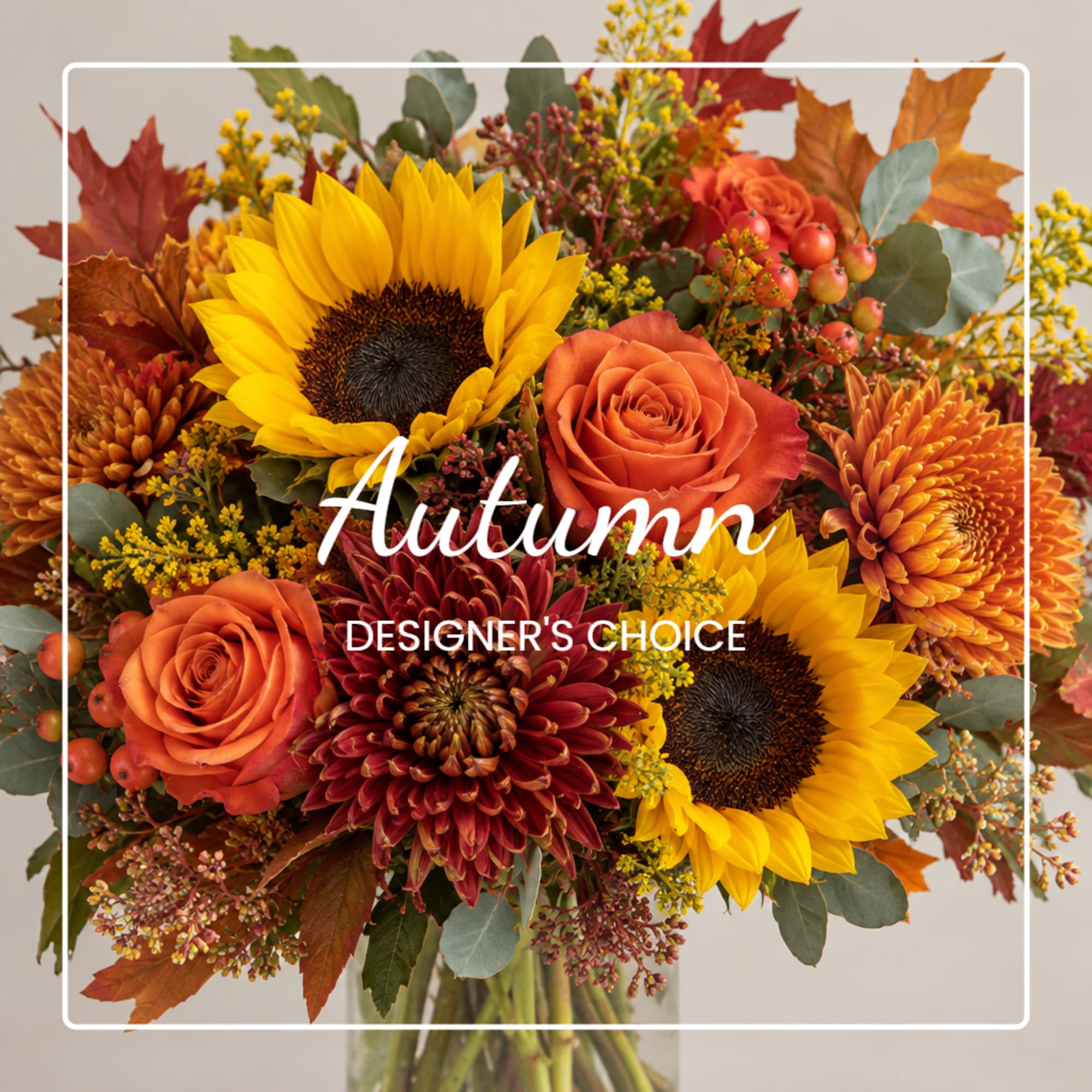 Autumn bouquet with sunflowers, orange roses, and chrysanthemums