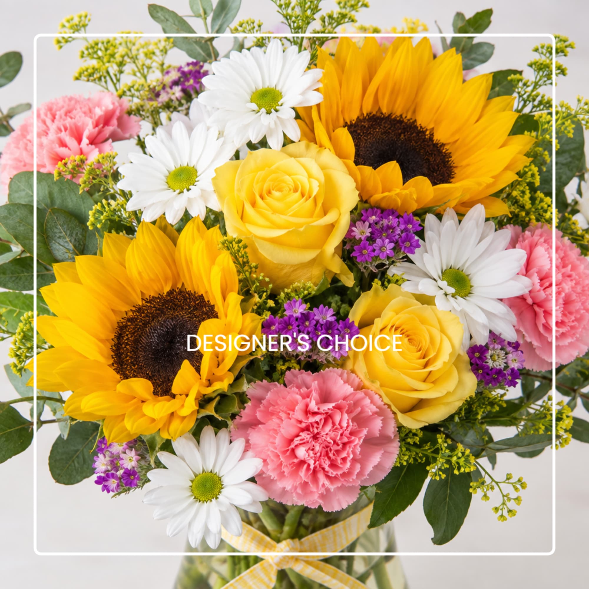 Bouquet of sunflowers, yellow roses, white daisies, and pink carnations