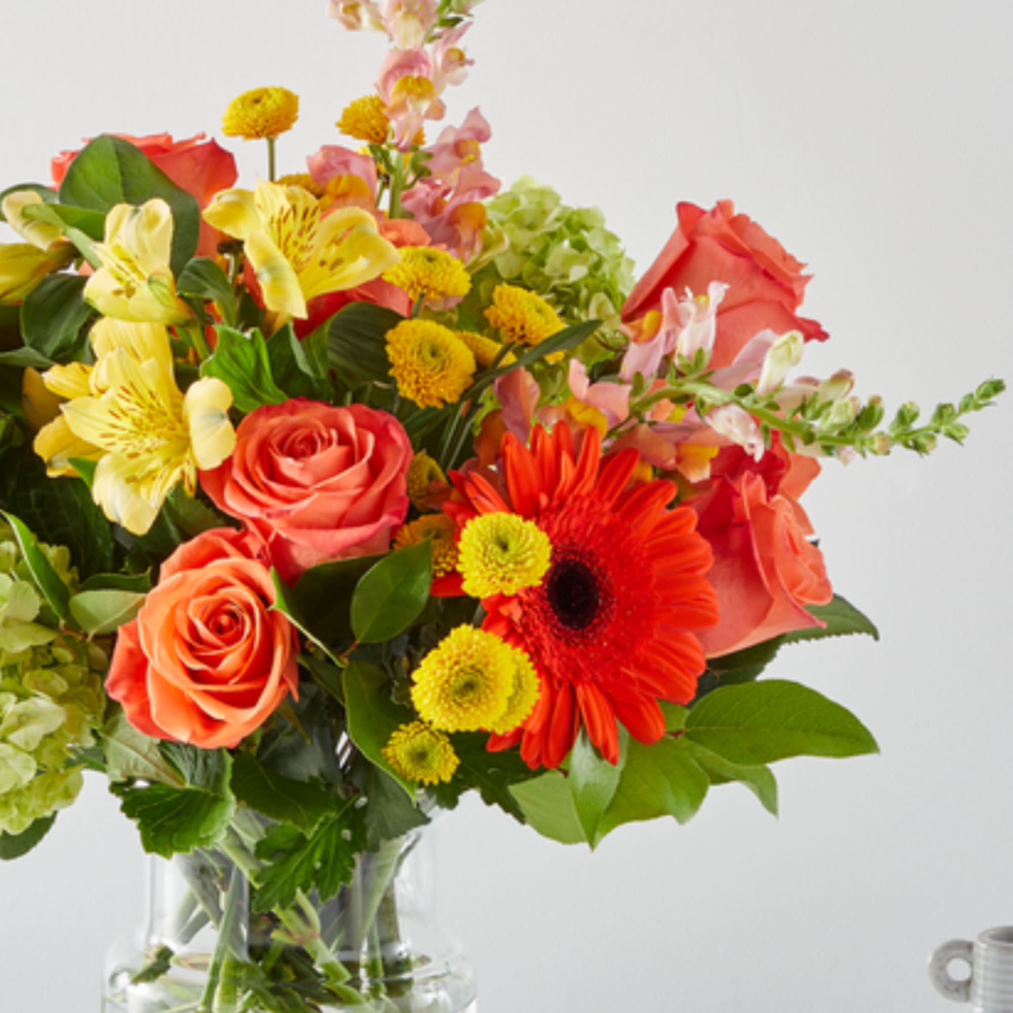 Mixed bouquet of roses, gerbera daisies, and alstroemeria in a glass vase, photo 3 of 4