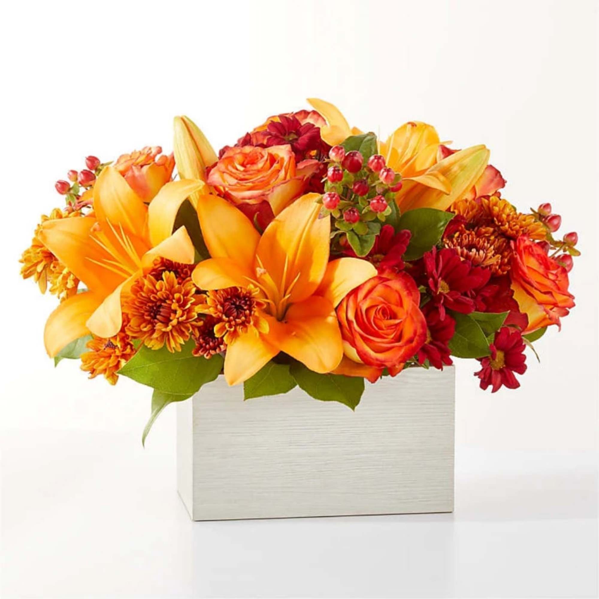 Orange lilies and roses in a white box