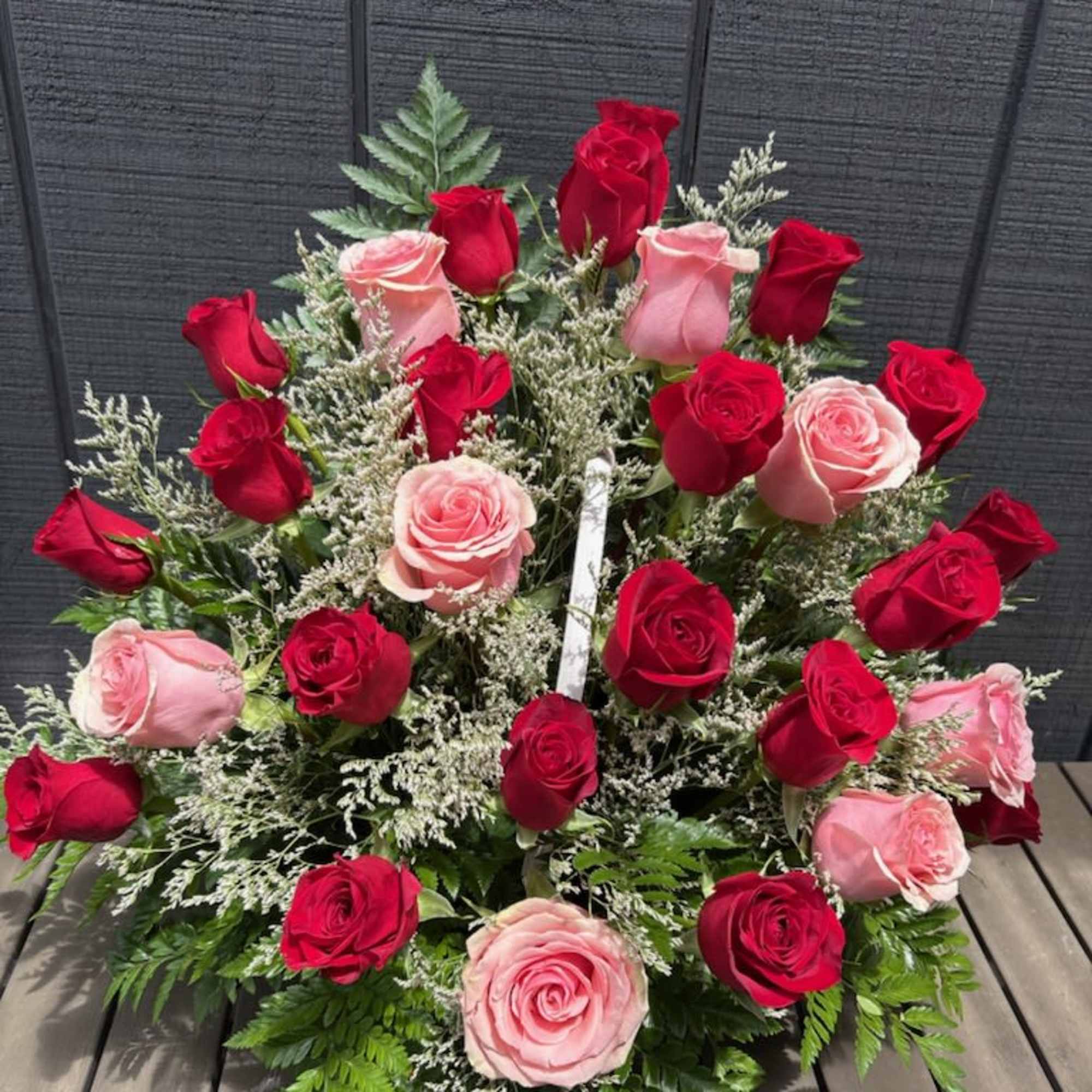 30 roses in your choice of color with greenery and delicate filler
