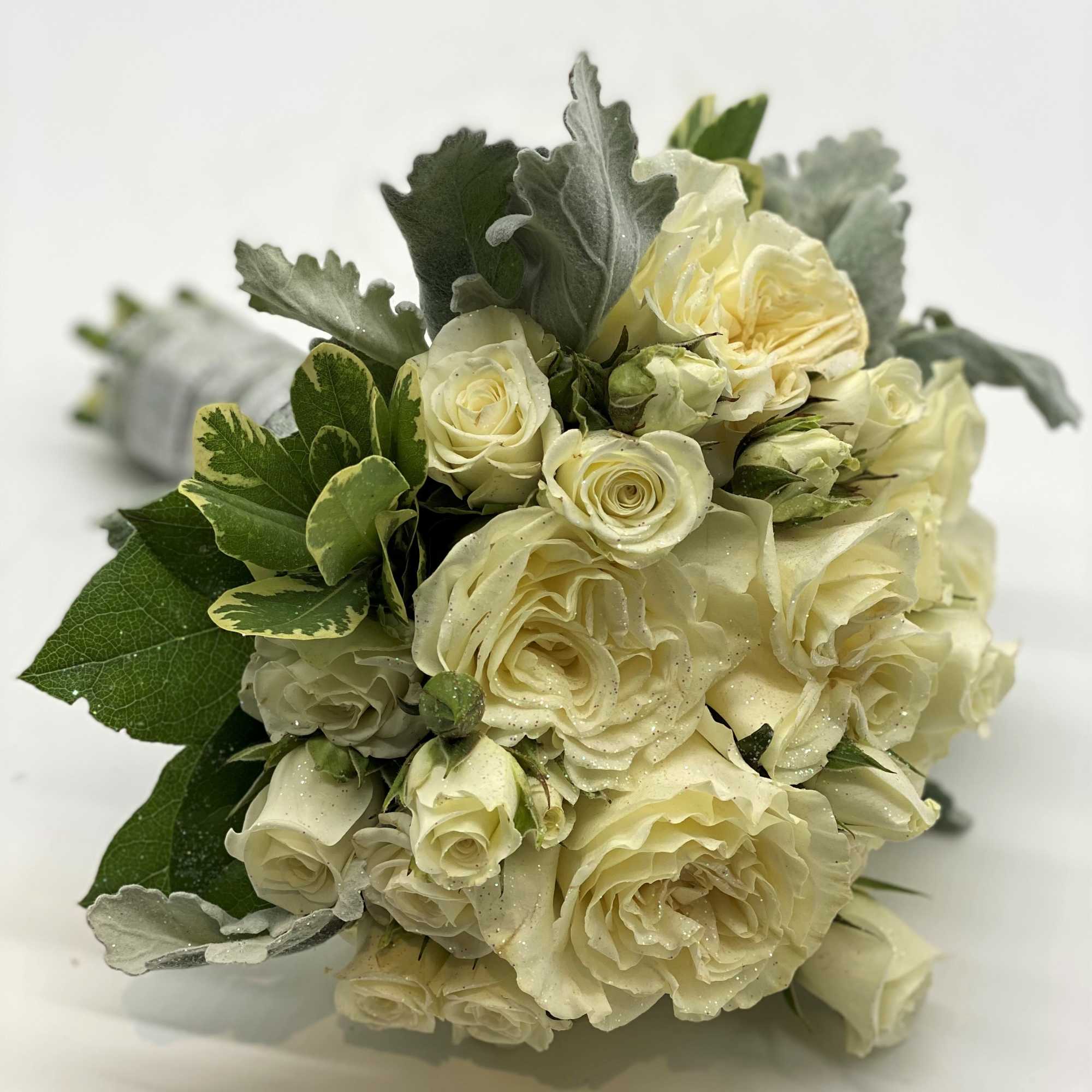 A lush mix of whites and creams, with dusty miller accent and