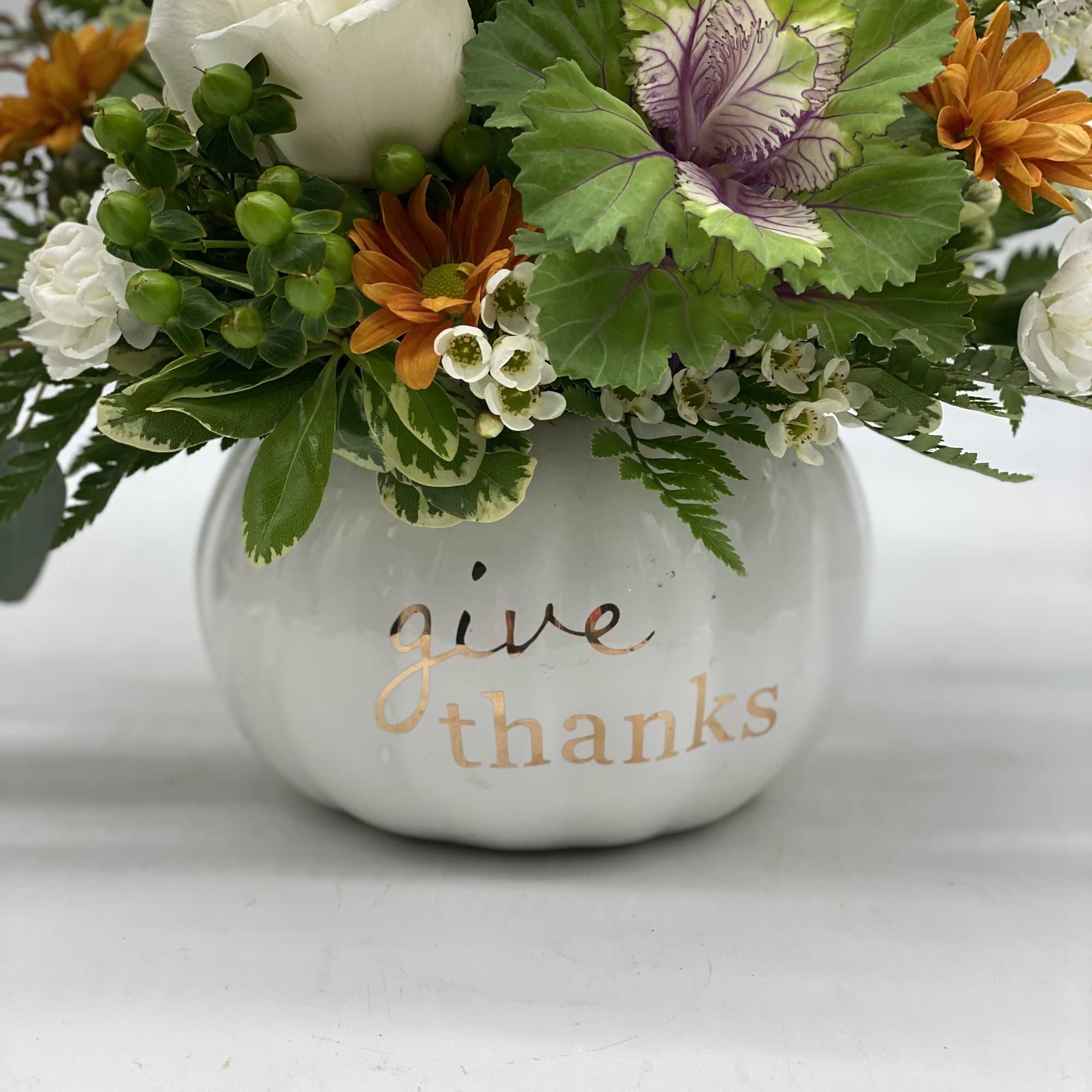 Adorned in a ceramic pumpkin keepsake container, this arrangement is full of, photo 2 of 3