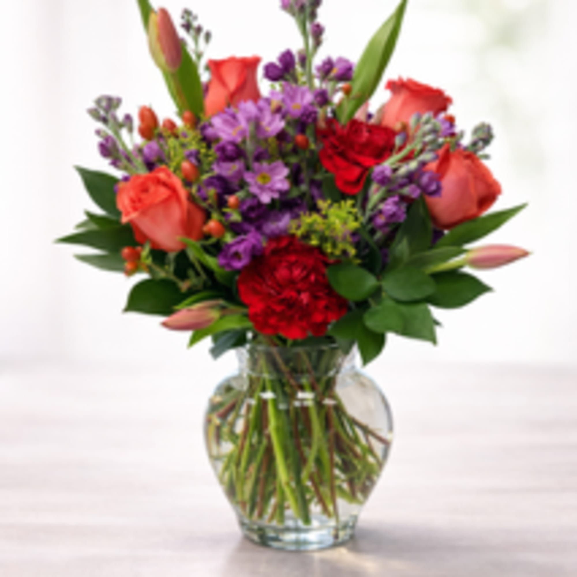 Celebrate good times with this lively bouquet. The arrangement includes roses, carnations