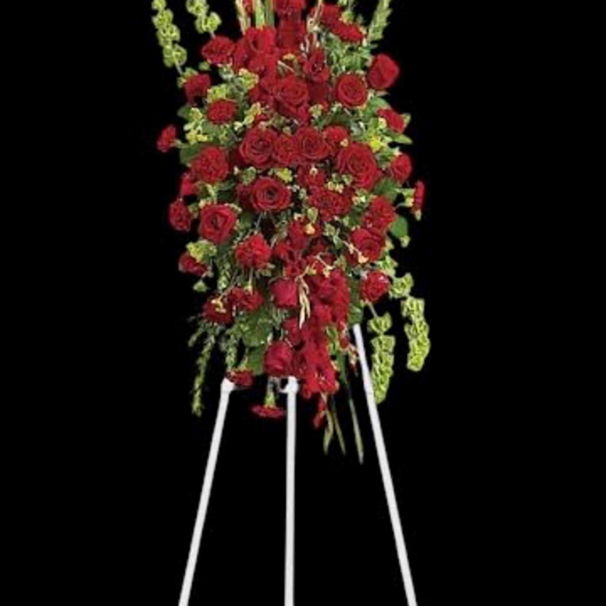 Tall red rose standing spray on a white easel