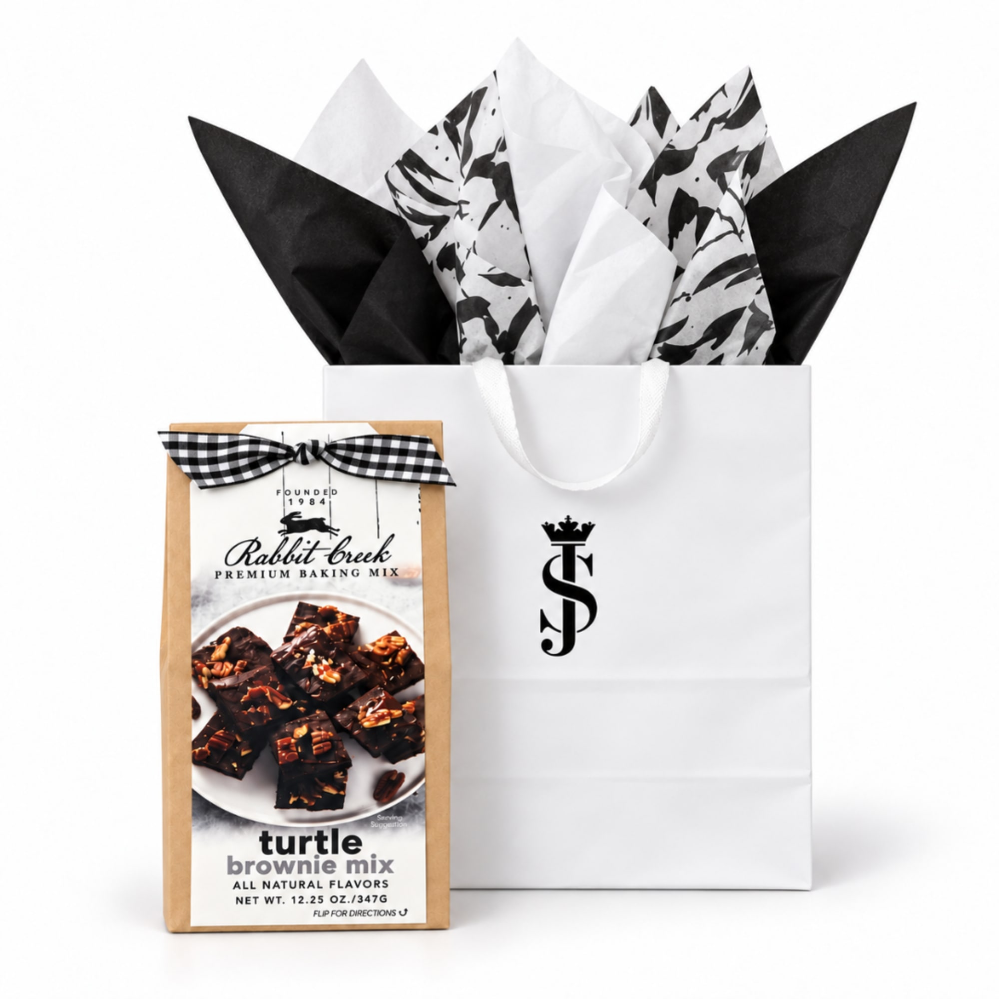 Gift bag with tissue paper and a brownie mix box