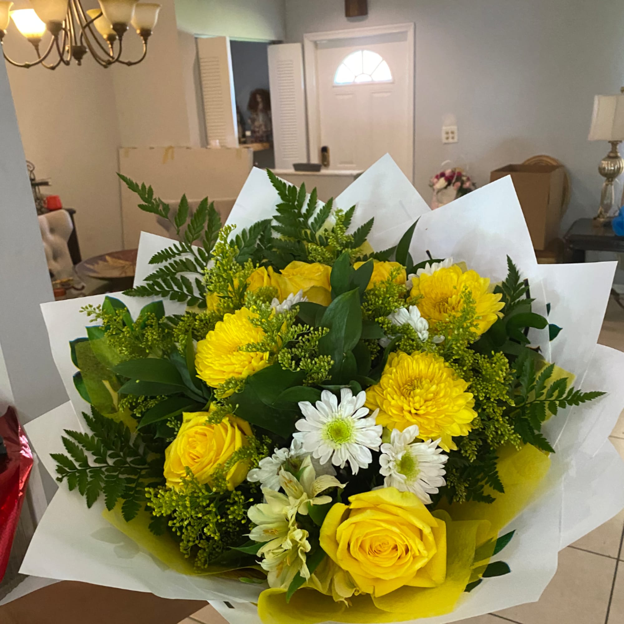 Yellow roses and white daisies in a wrapped bouquet, photo 2 of 2