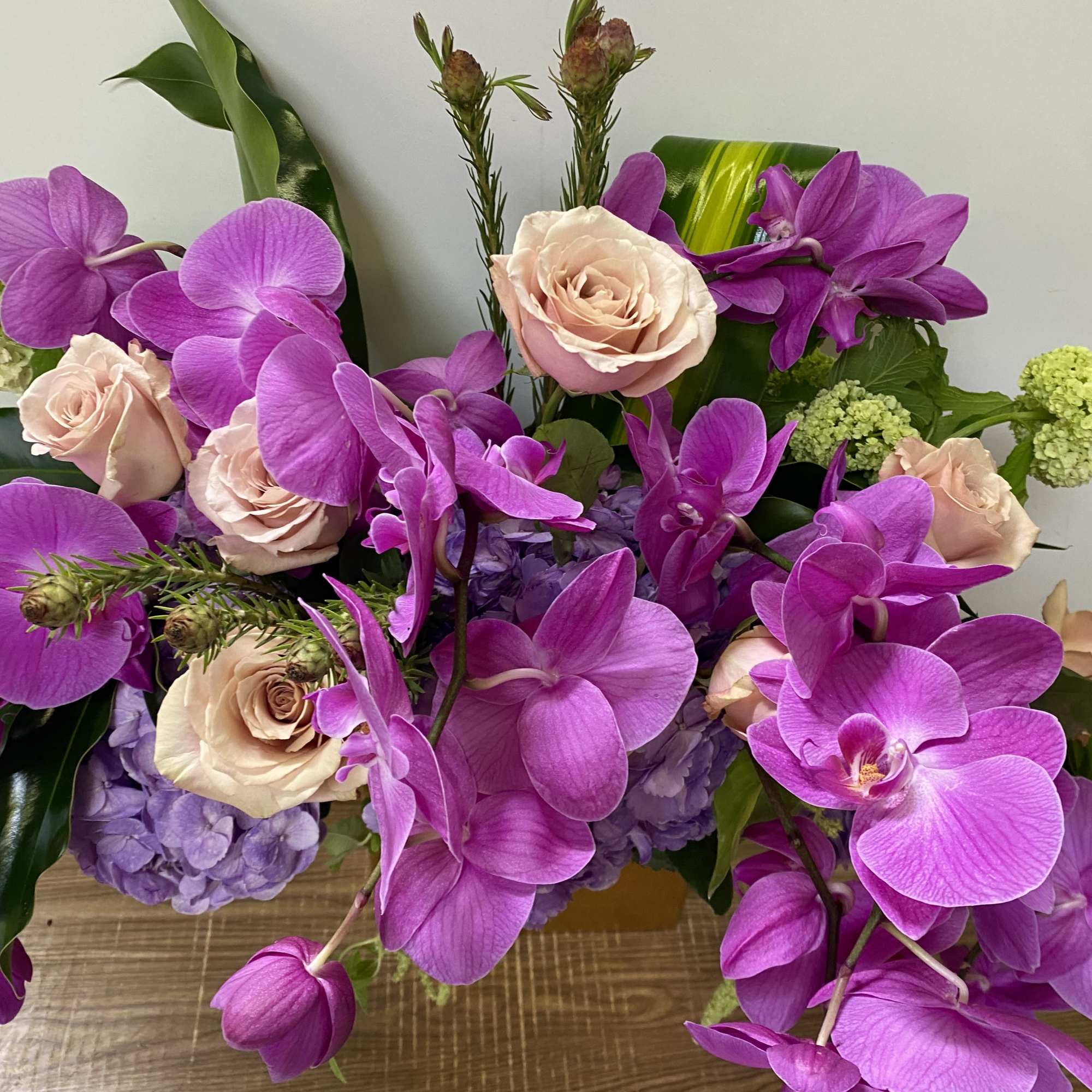 In a beautiful ceramic pot, combination of purple, hydrogen and purple orchids, photo 3 of 3
