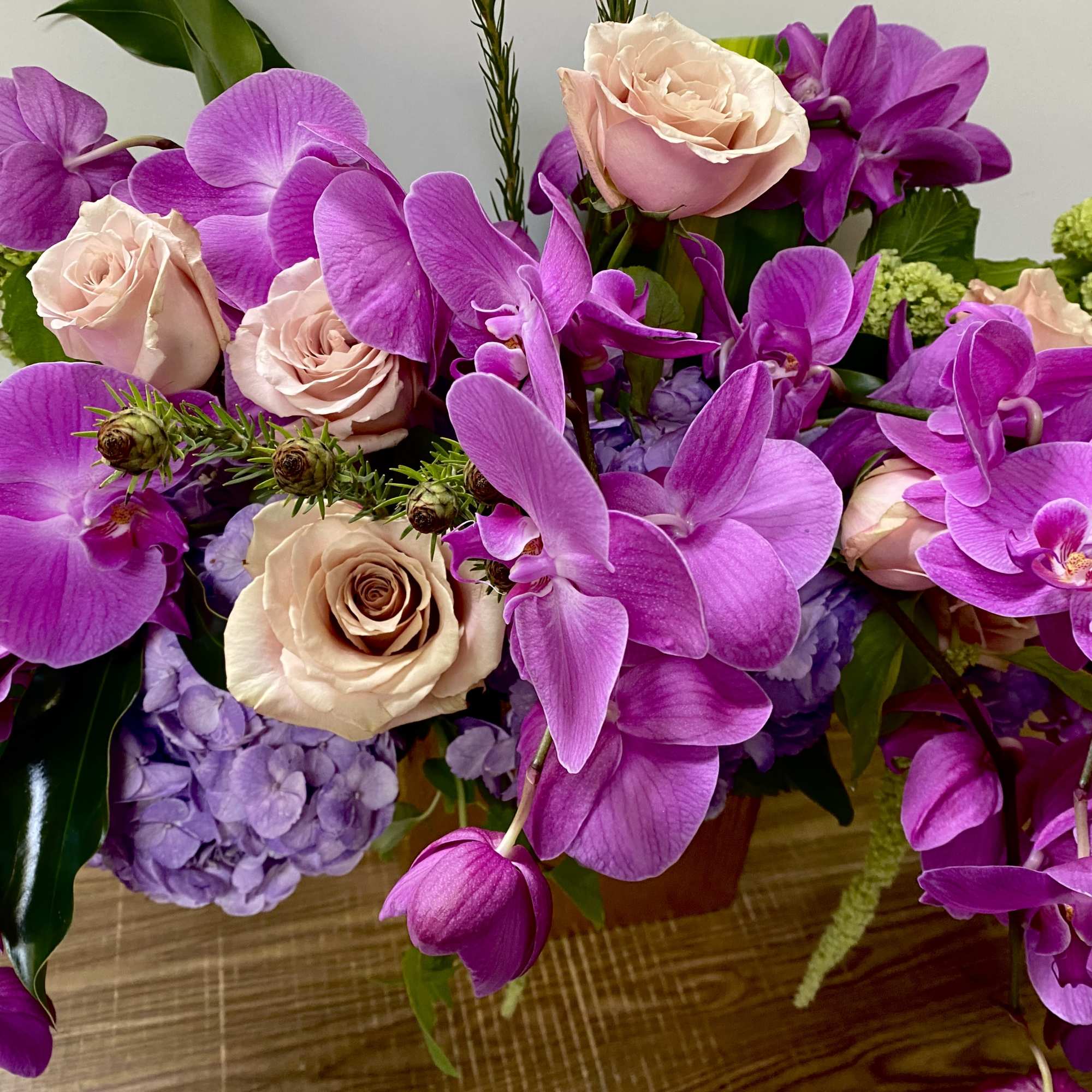 In a beautiful ceramic pot, combination of purple, hydrogen and purple orchids, photo 2 of 3