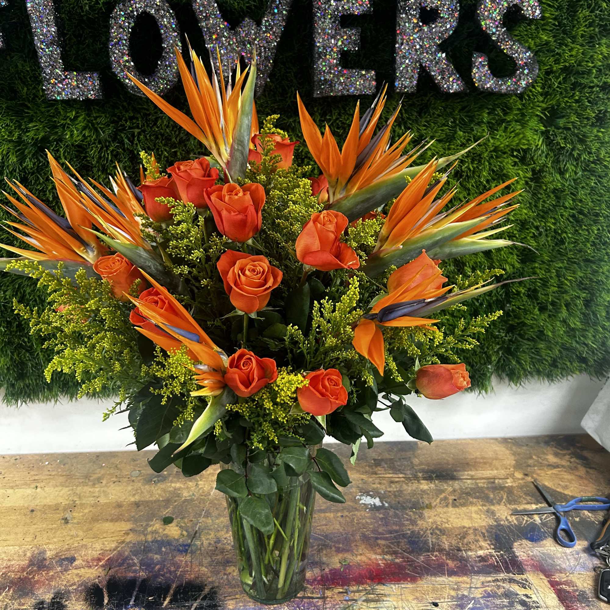 1 dozen bird of paradise and 2 dozen of roses