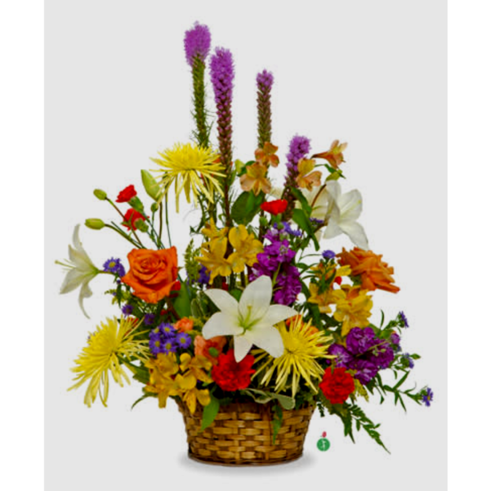 Colorful mixed flower arrangement in a woven basket with lilies and roses, photo 2 of 2