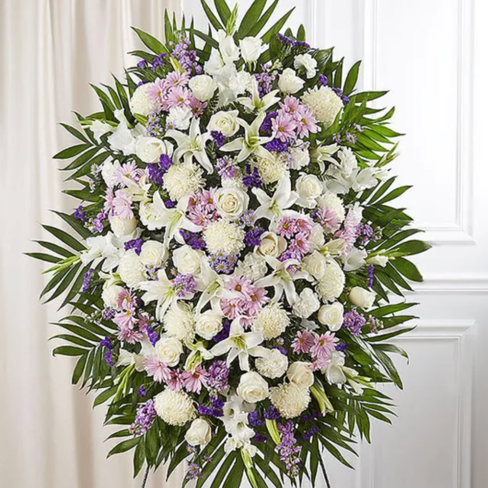 Large standing spray of white, pink, and purple flowers