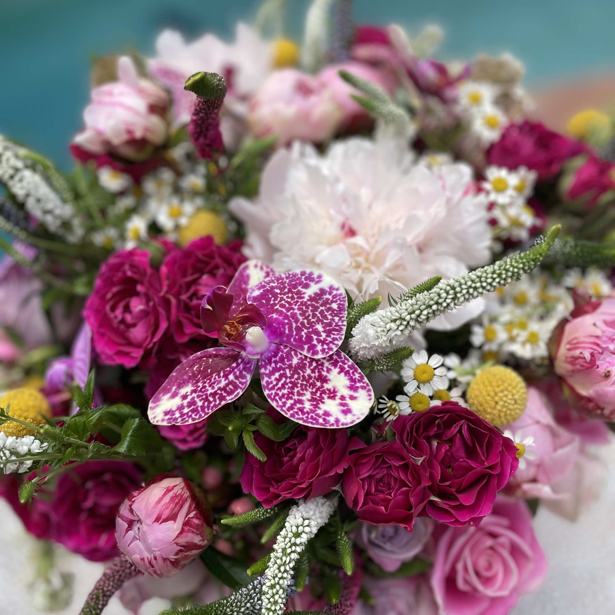 Pink and white mixed bouquet with orchids and roses