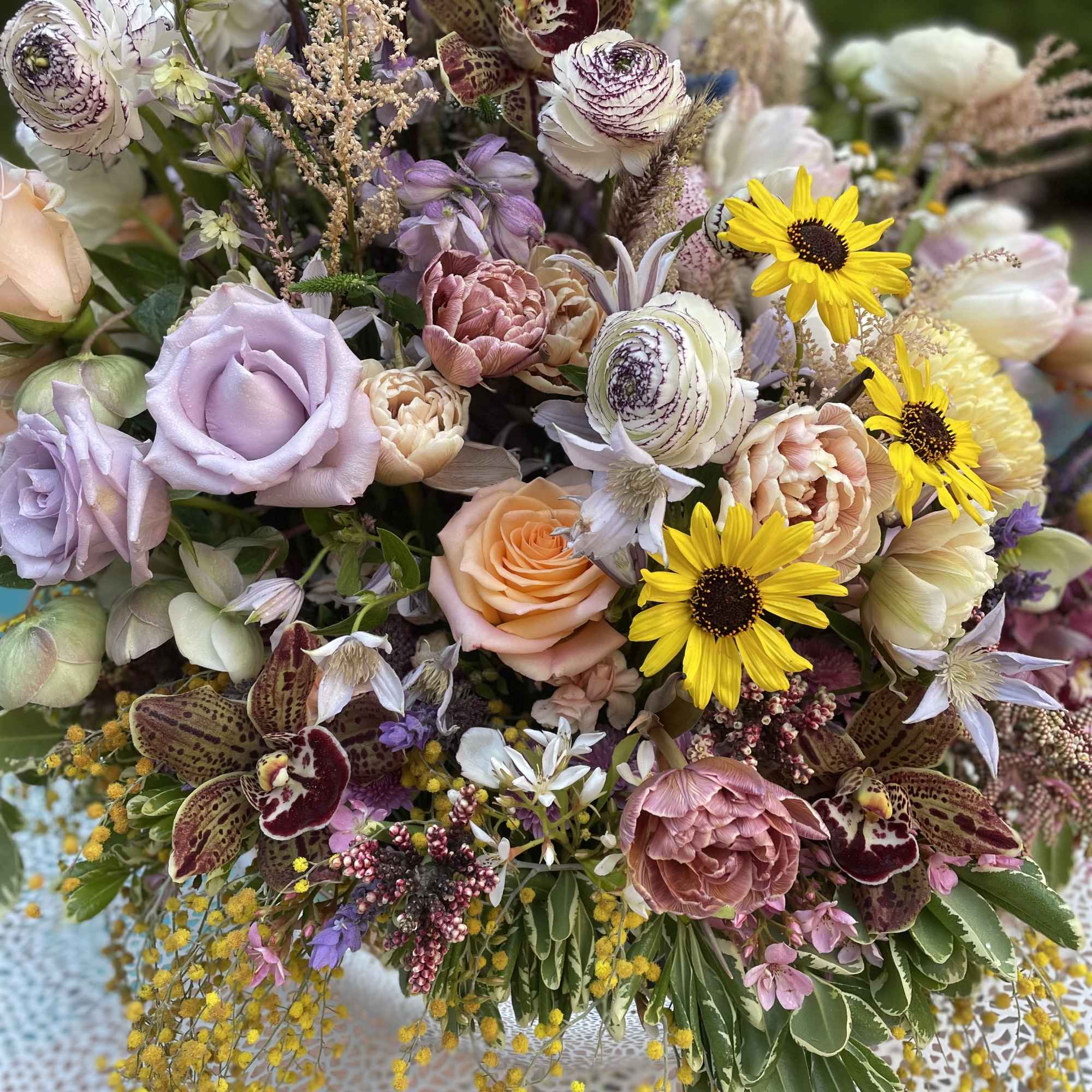 Mixed bouquet with lavender roses, yellow daisies, and orchids, photo 2 of 9