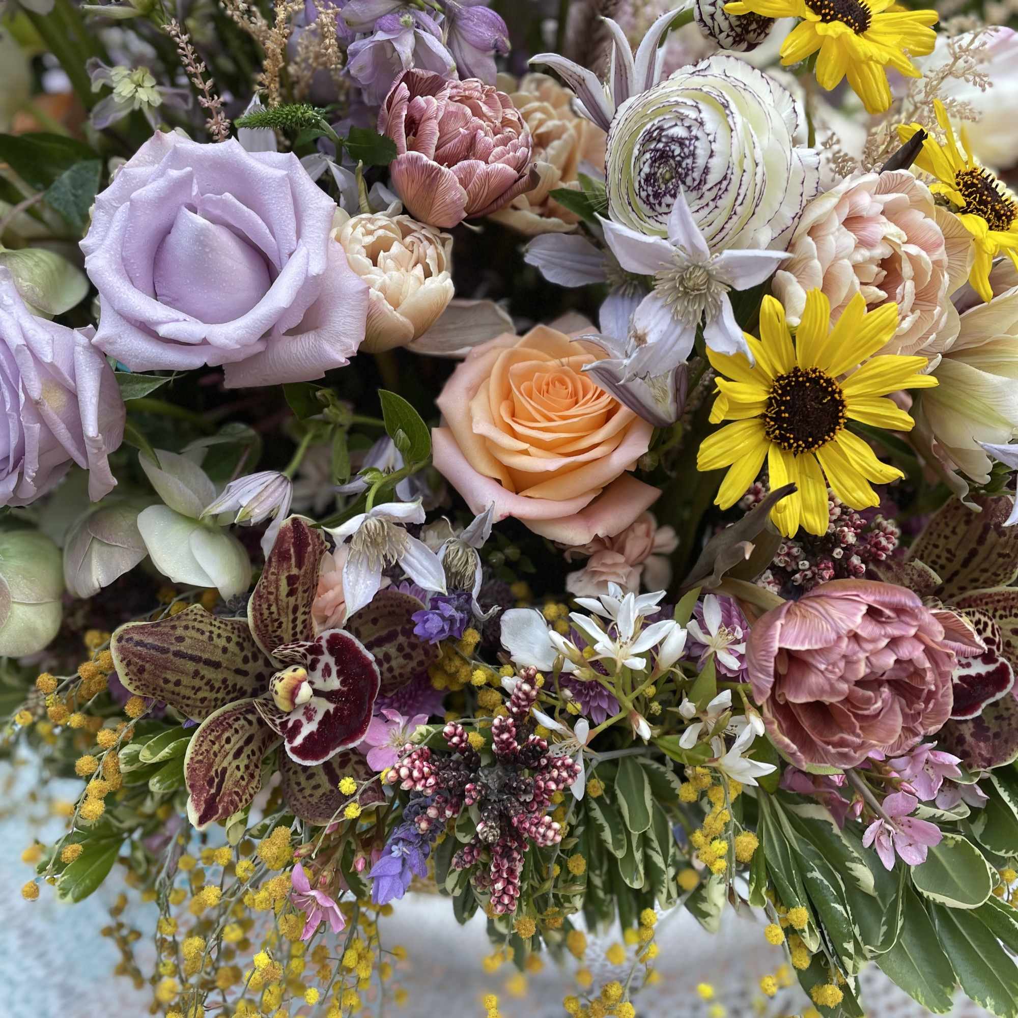 Mixed bouquet with lavender roses, yellow daisies, and orchids, photo 9 of 9