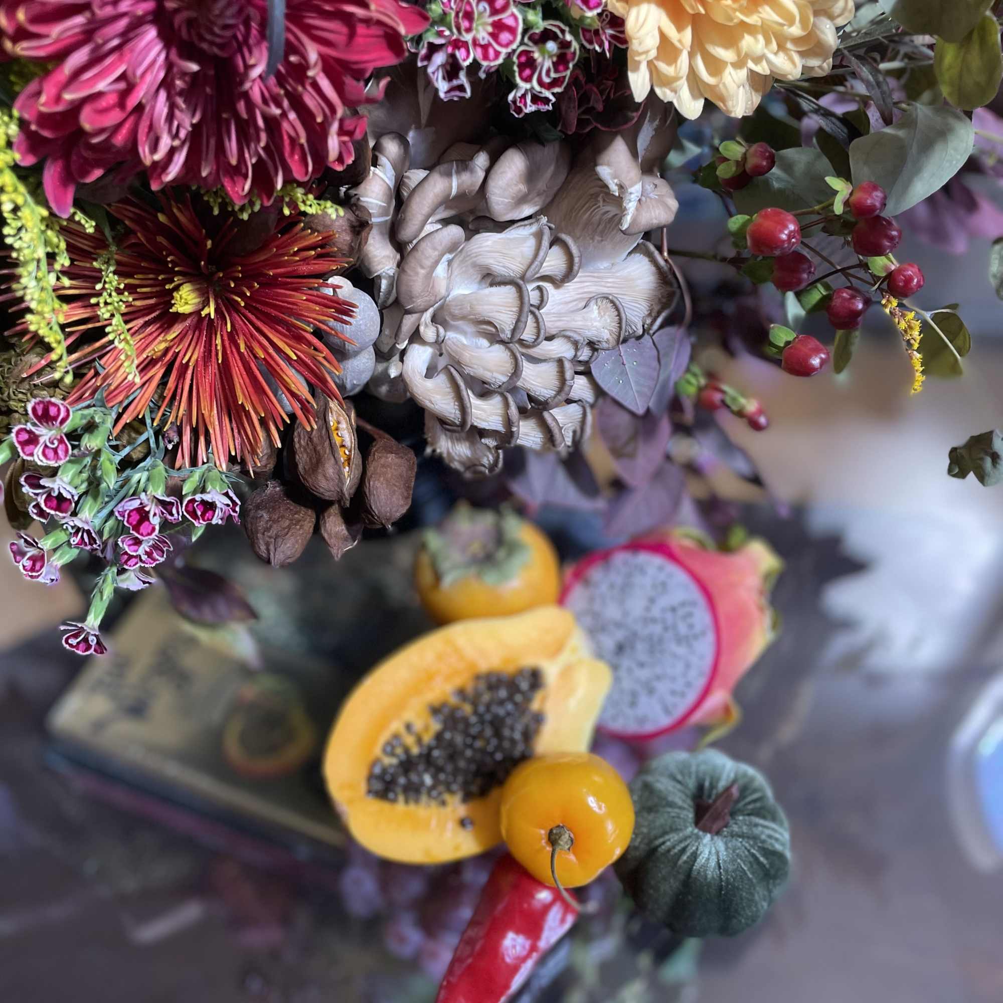 Mixed bouquet with chrysanthemums and decorative fruit accents