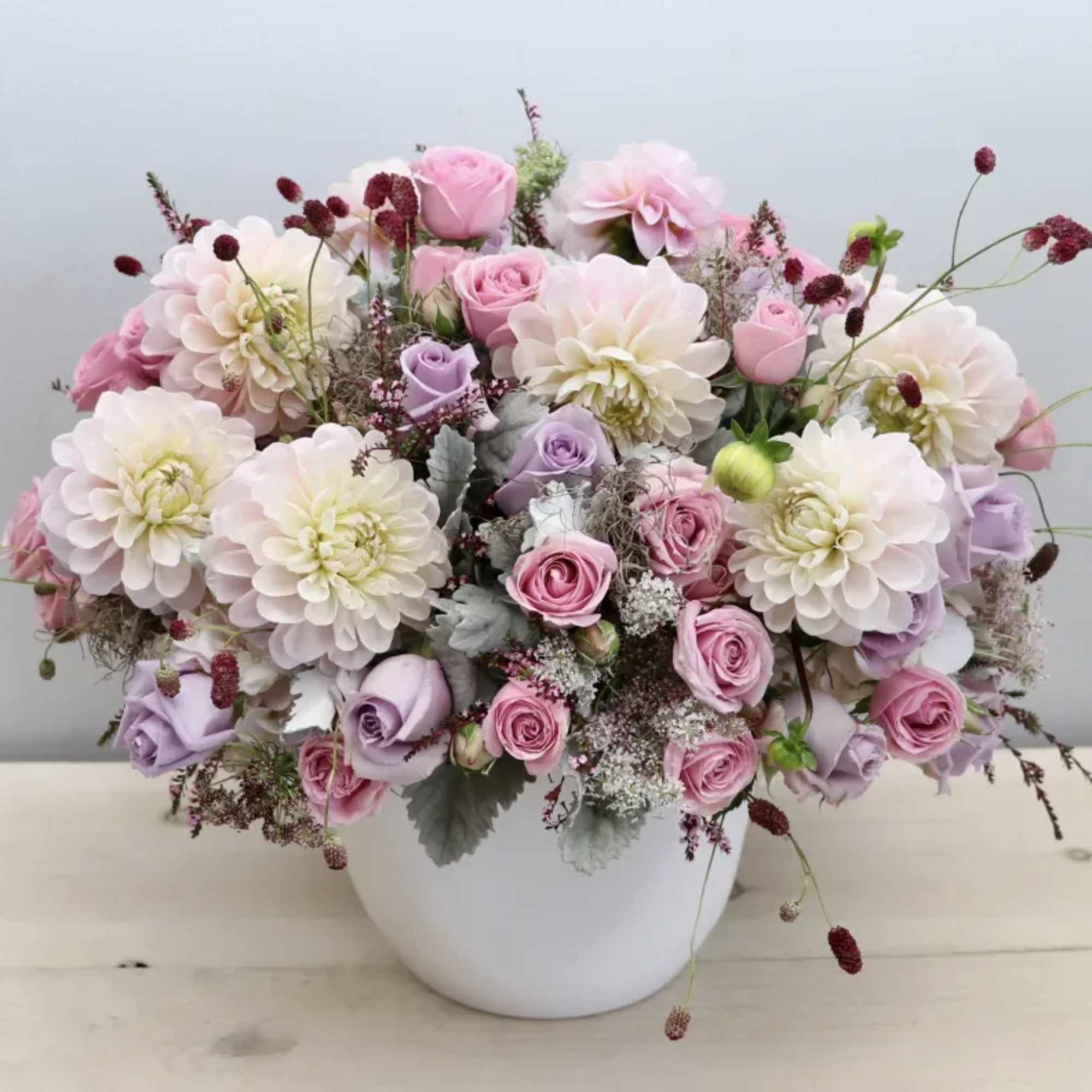 Pink and white flower arrangement in a white vase, photo 6 of 6