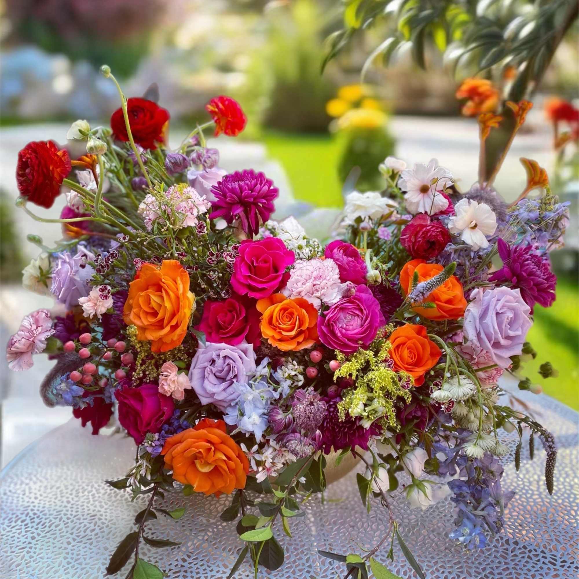 Colorful mixed bouquet of roses and assorted flowers on a table