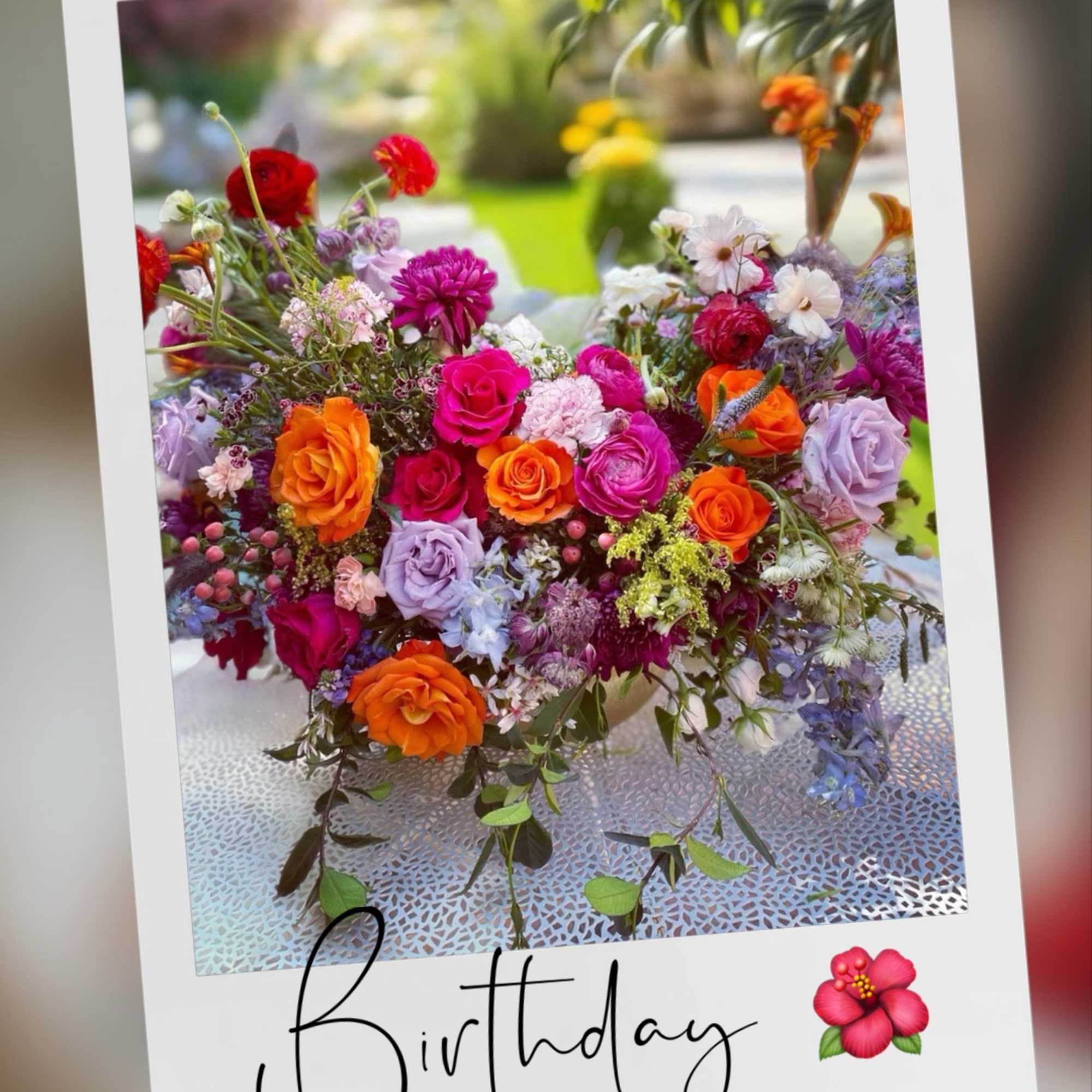 Colorful mixed bouquet with roses and other blooms on a birthday card