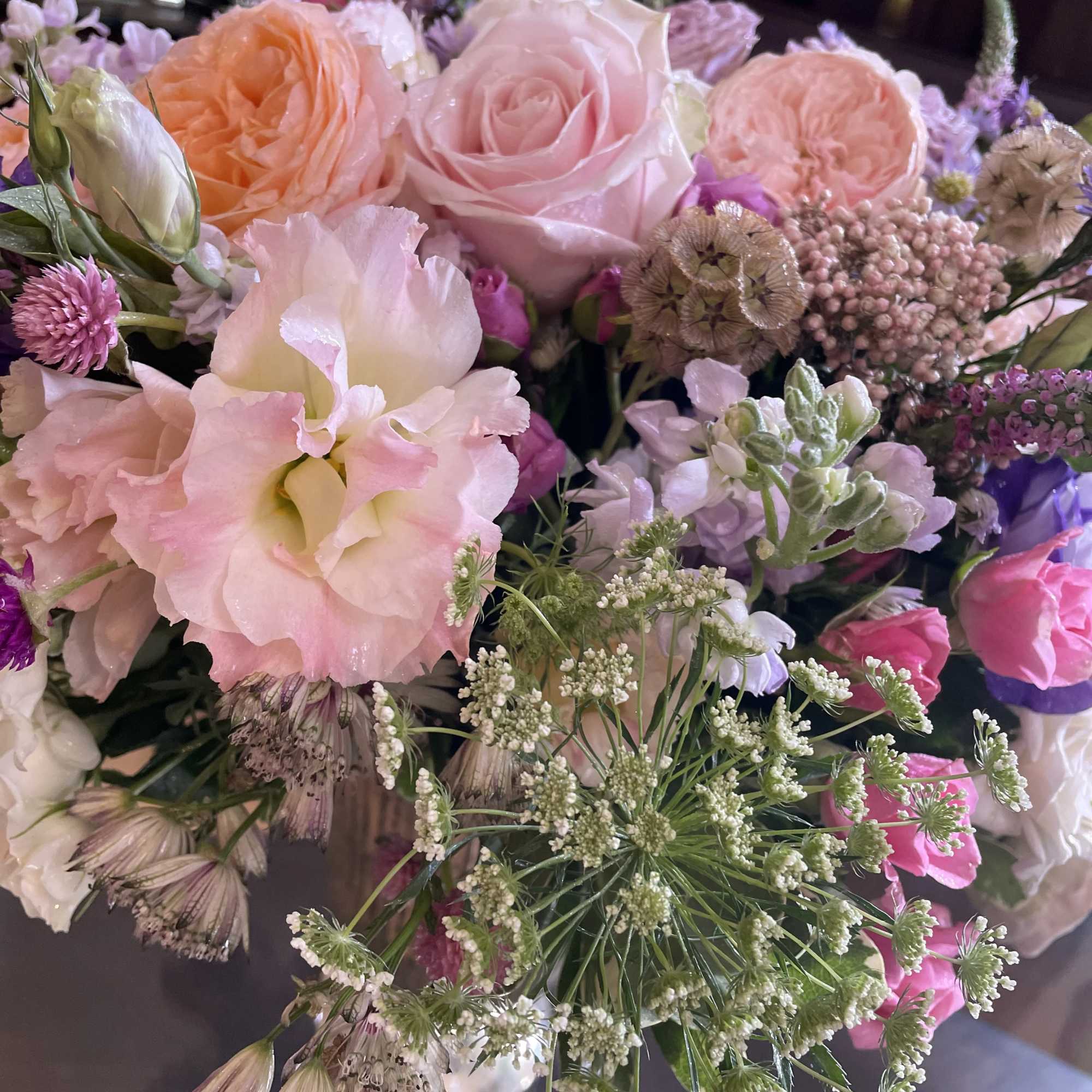 Bouquet of pink and peach roses with pale pink blooms