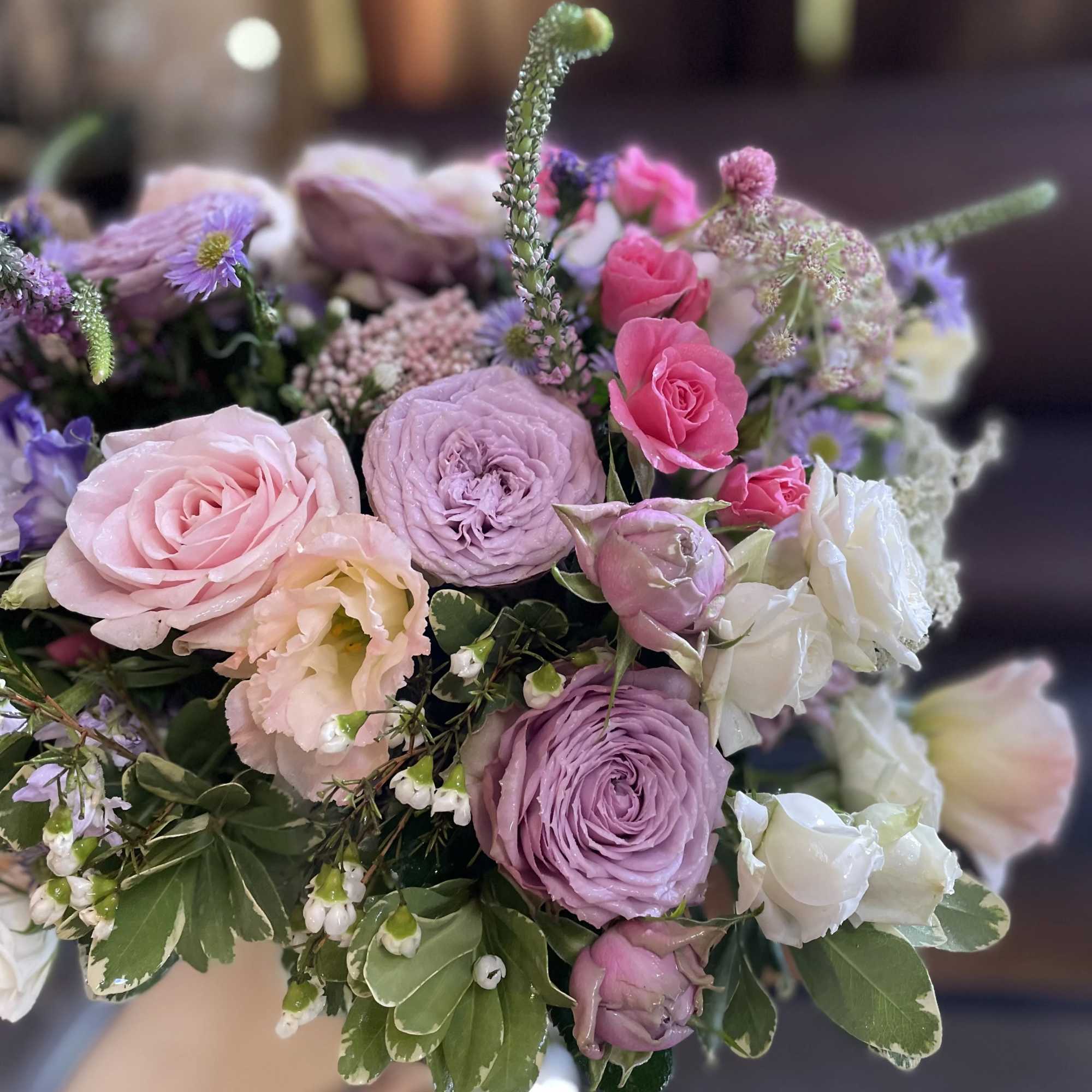 Pastel bouquet of pink, lavender, and white flowers