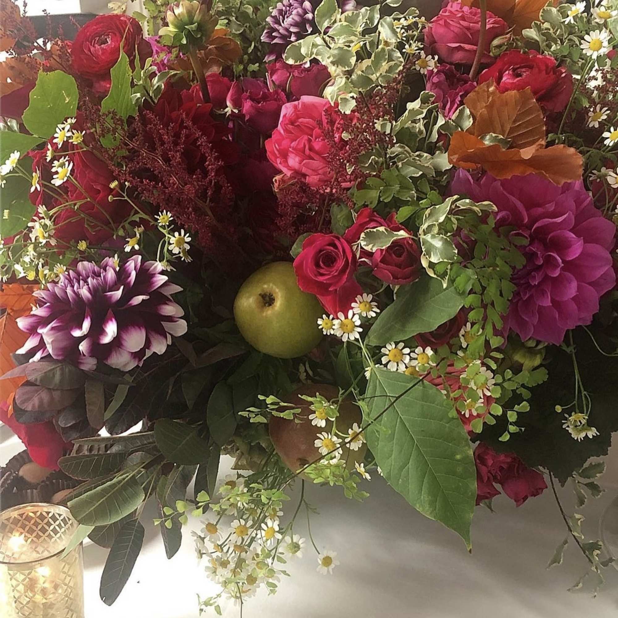 Mixed bouquet with pink roses, purple dahlias, and small white daisies