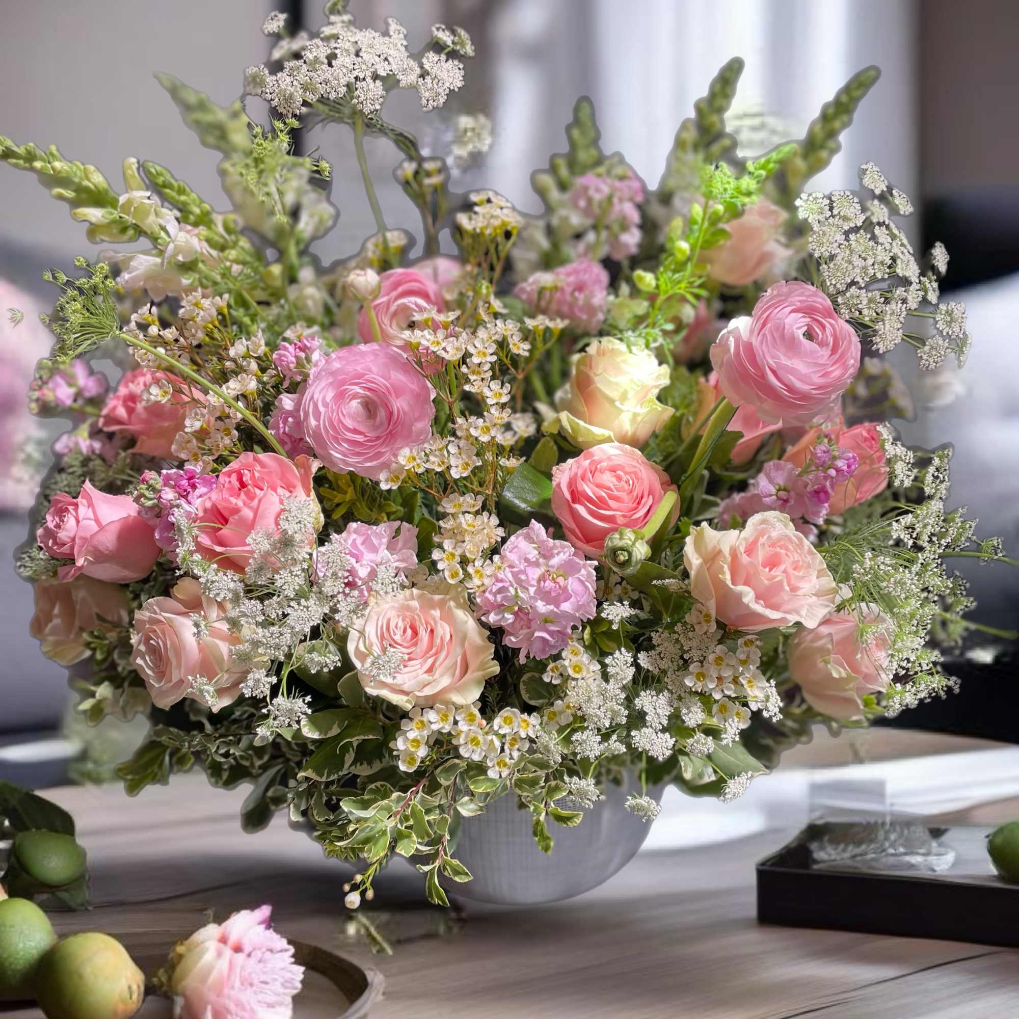 Pink and cream bouquet in a white vase
