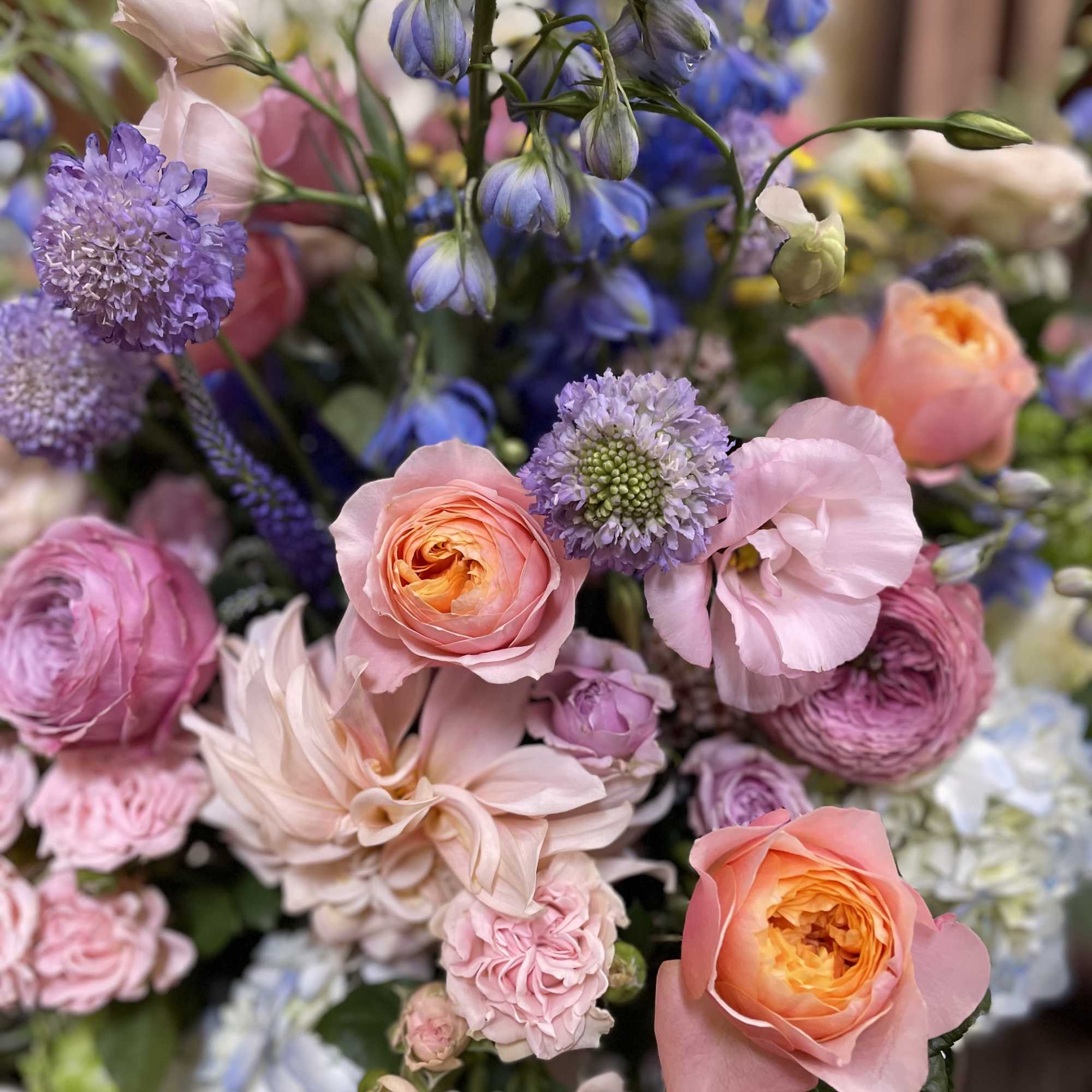 Mixed bouquet of pink, peach, and lavender flowers