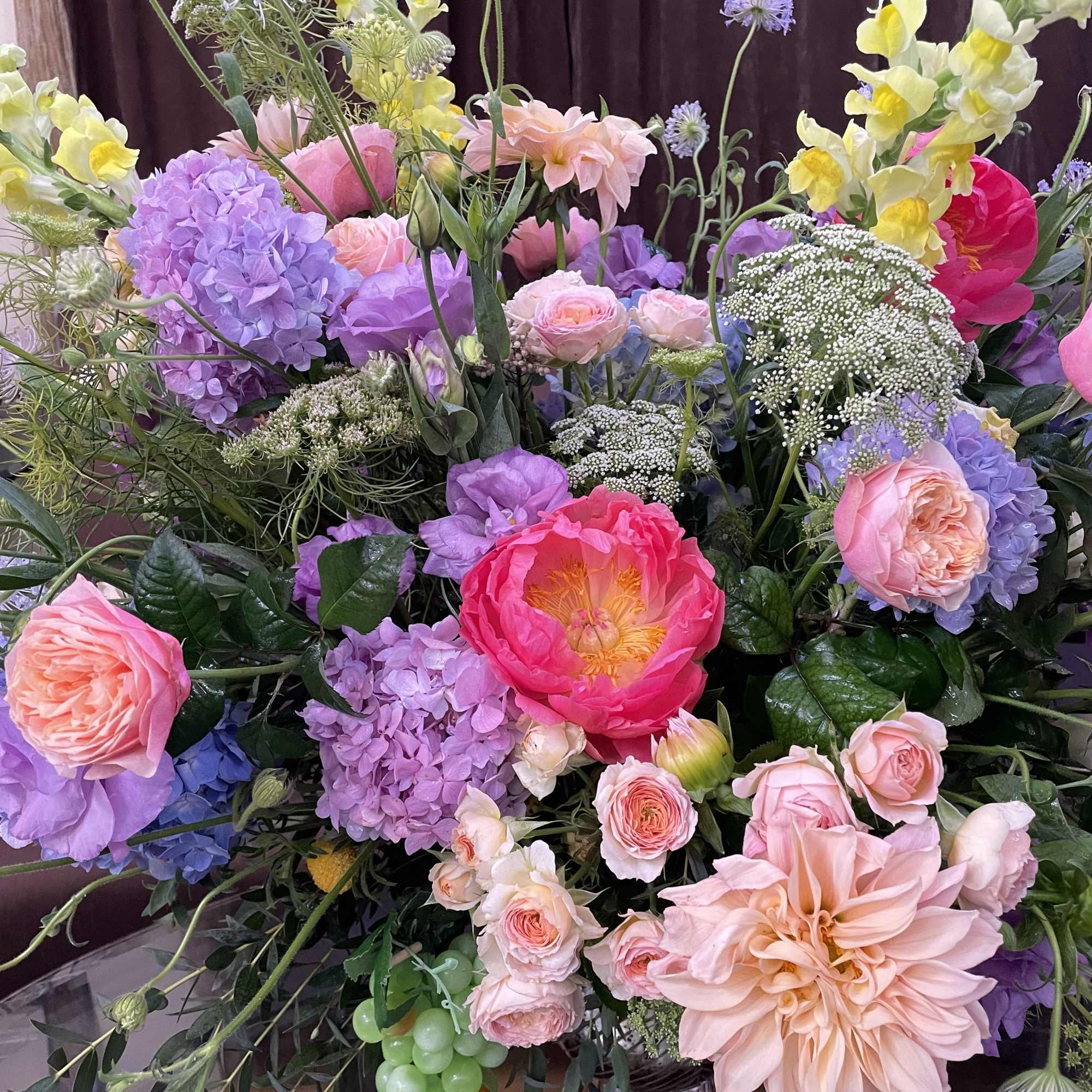 Large pastel bouquet with pink, purple, and yellow blooms