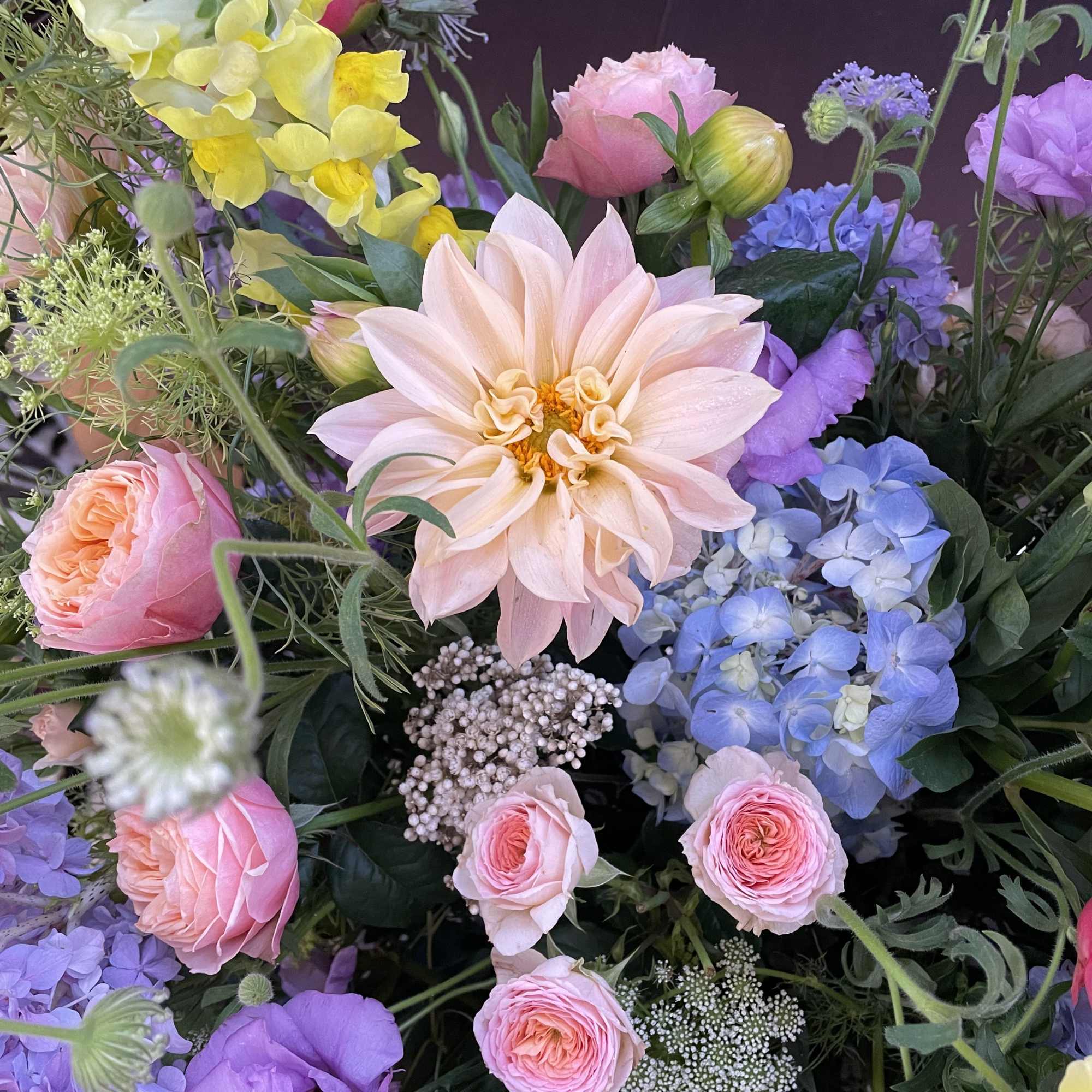 Mixed bouquet with pink, purple, yellow, and blue flowers