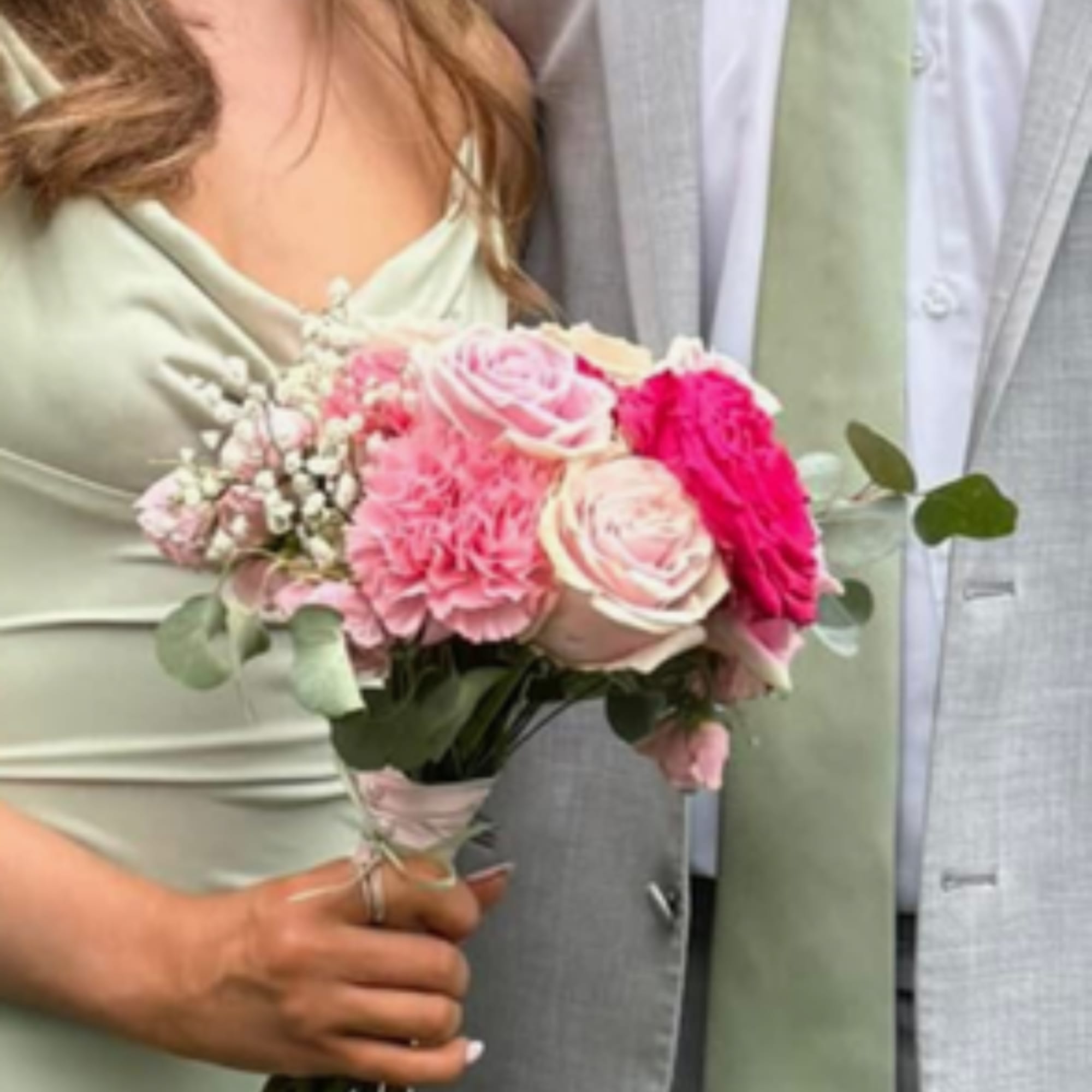 Bridal bouquet of pink and white roses with baby's breath